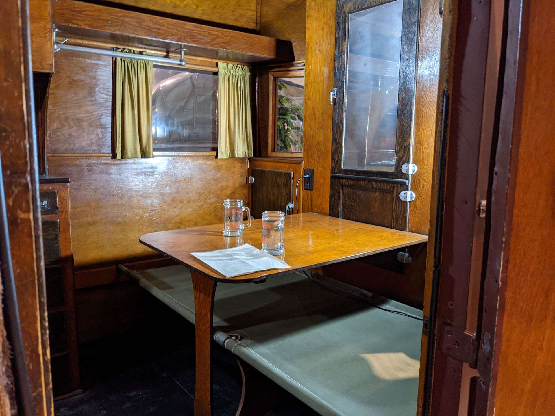 Dining table inside of covered wagon.
