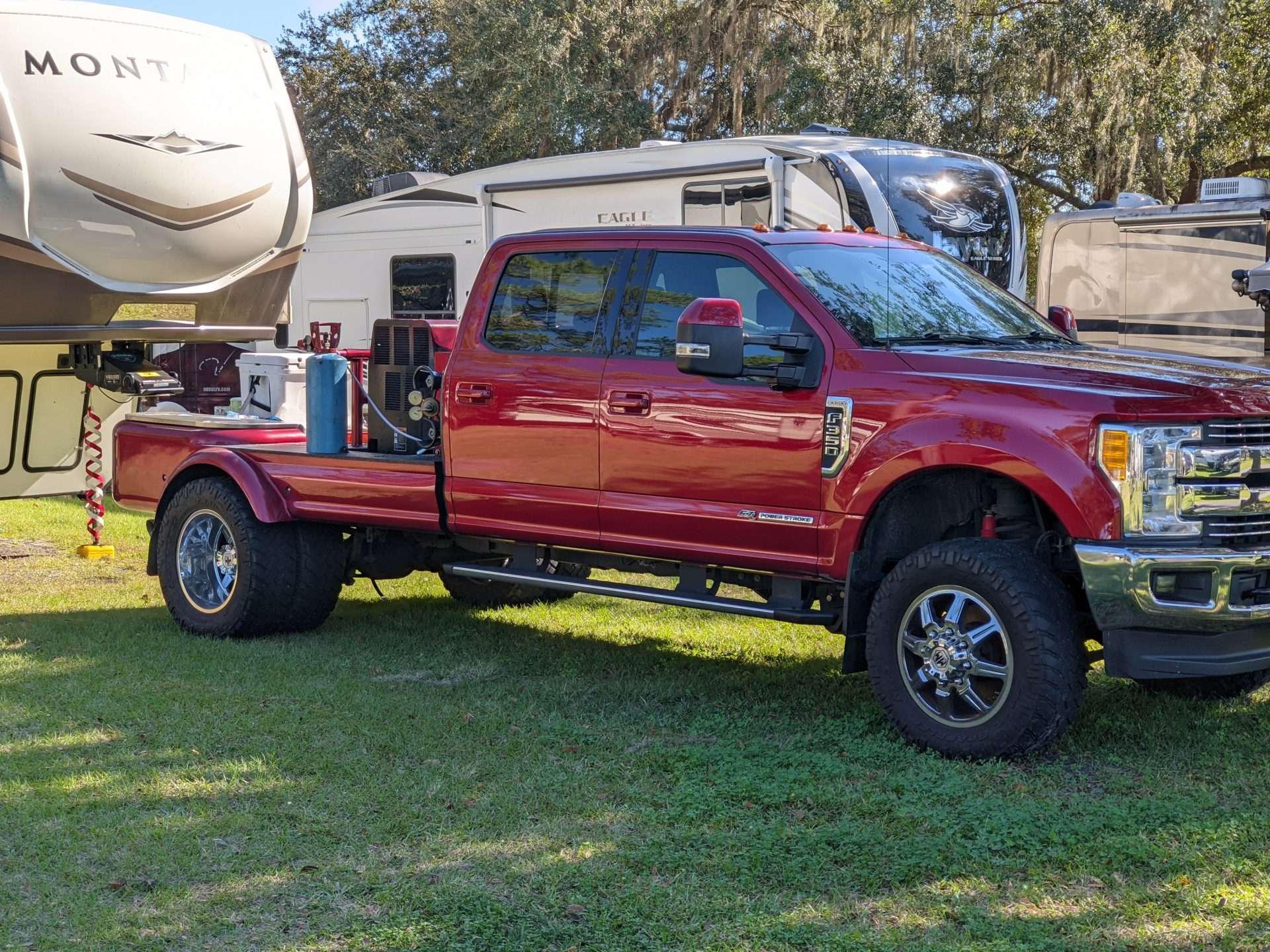 Red truck parked at campsite