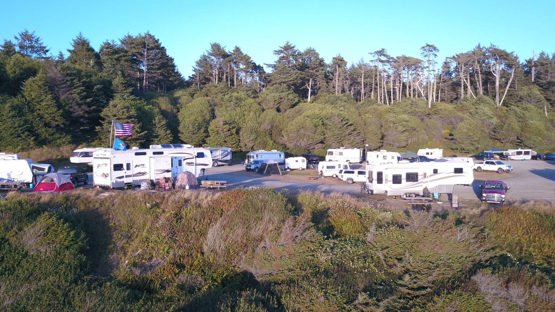 RVs parked in campsite along the beach