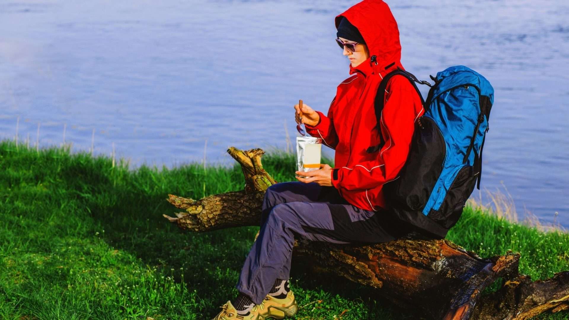 Hiker eating food from a pouch