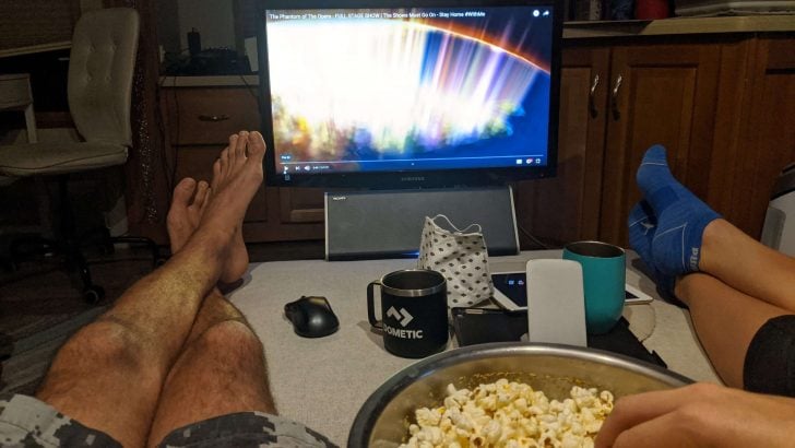eating popcorn and streaming a movie