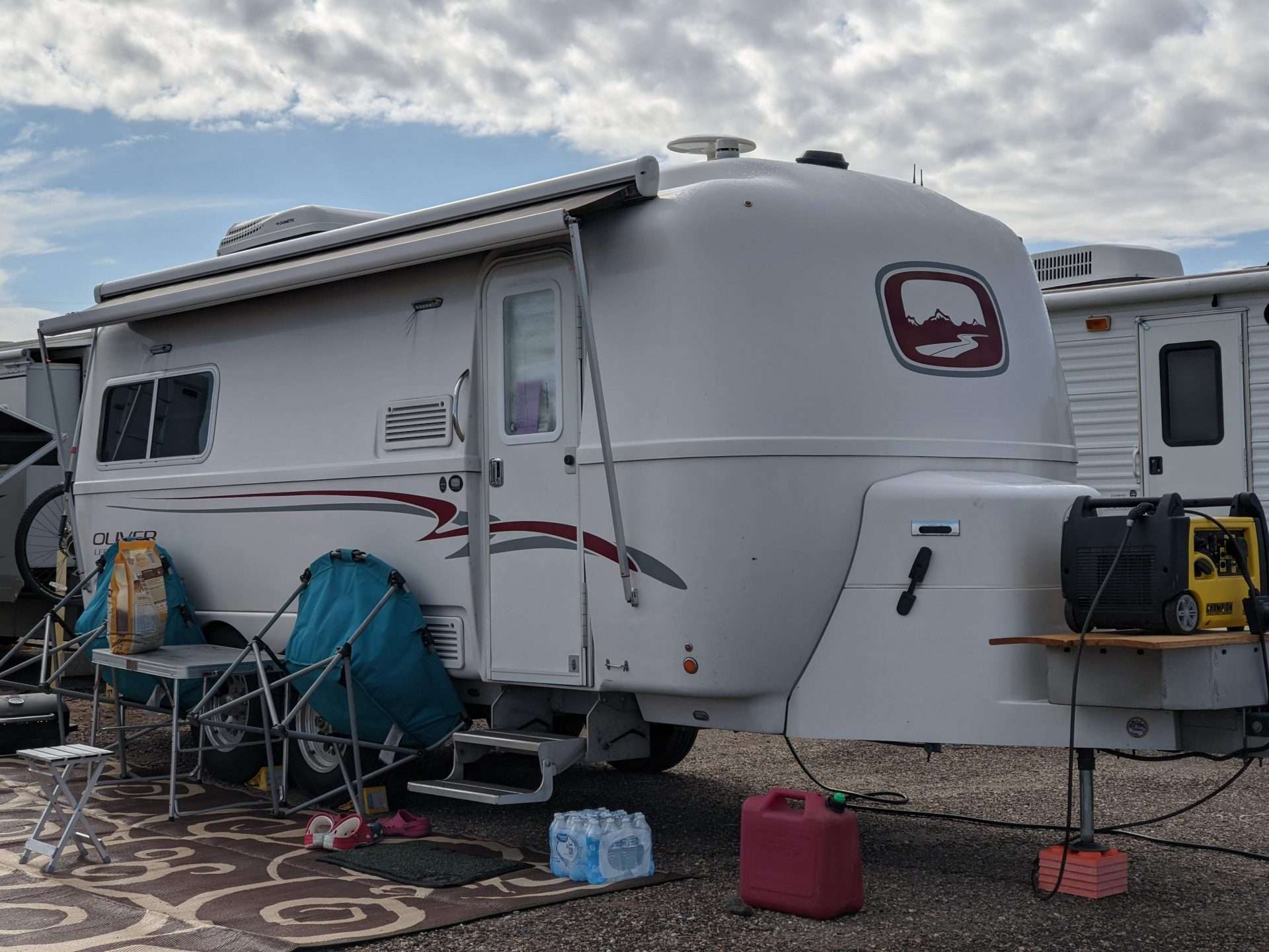 Oliver fiberglass camper at campsite.