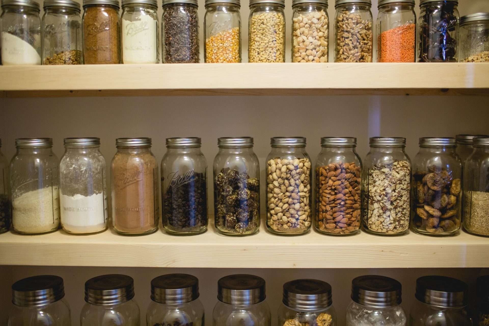 Pantry filled with just glass jars.