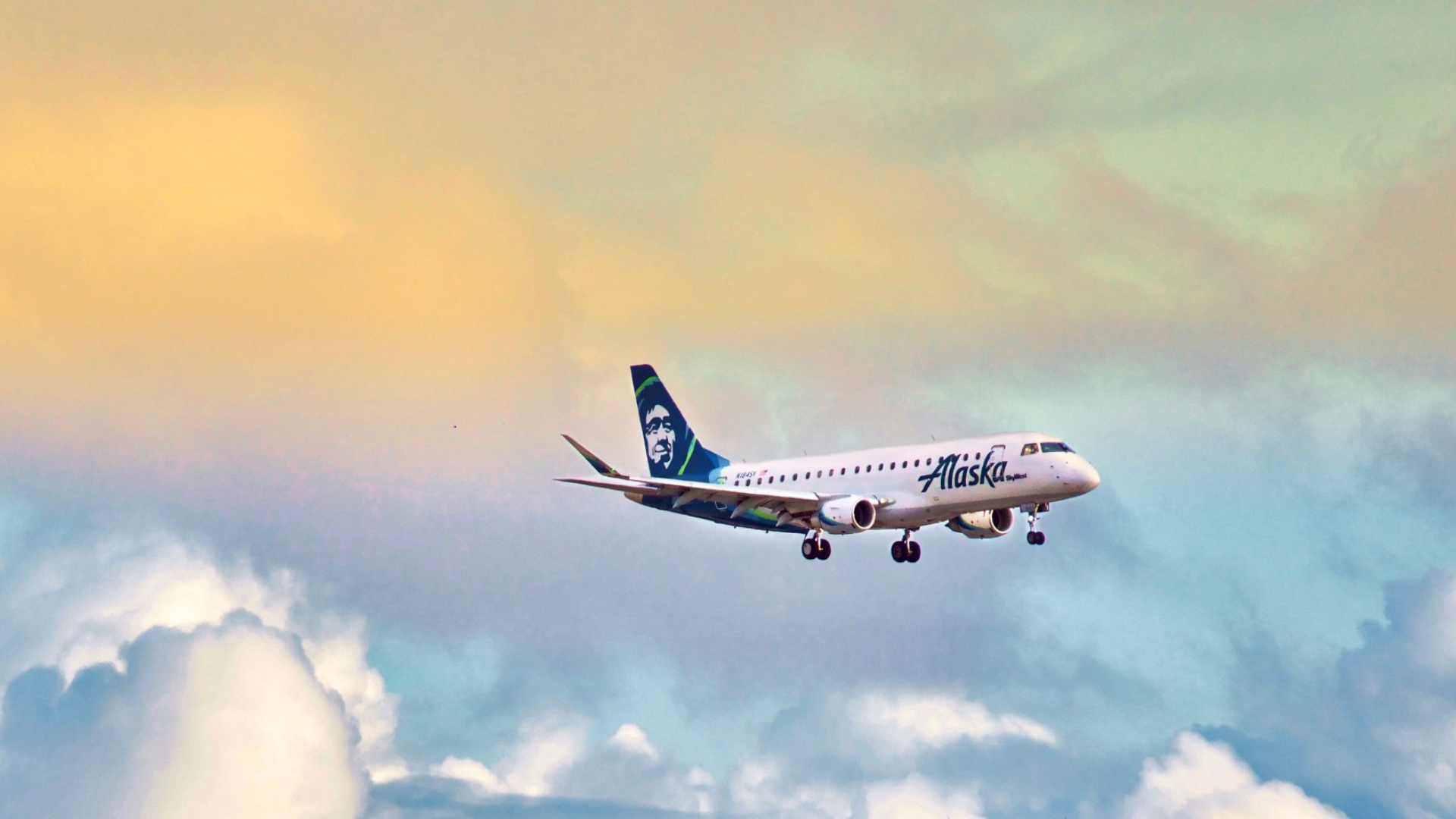 Alaska Airlines plane flying in sky