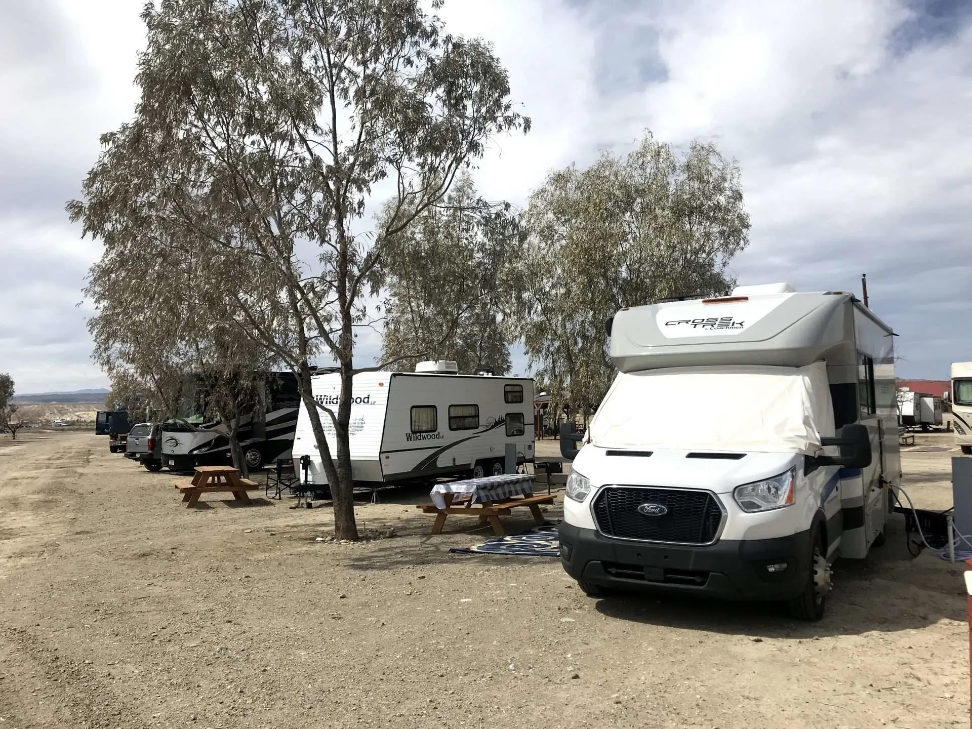 RVs parked in spots at campsite.