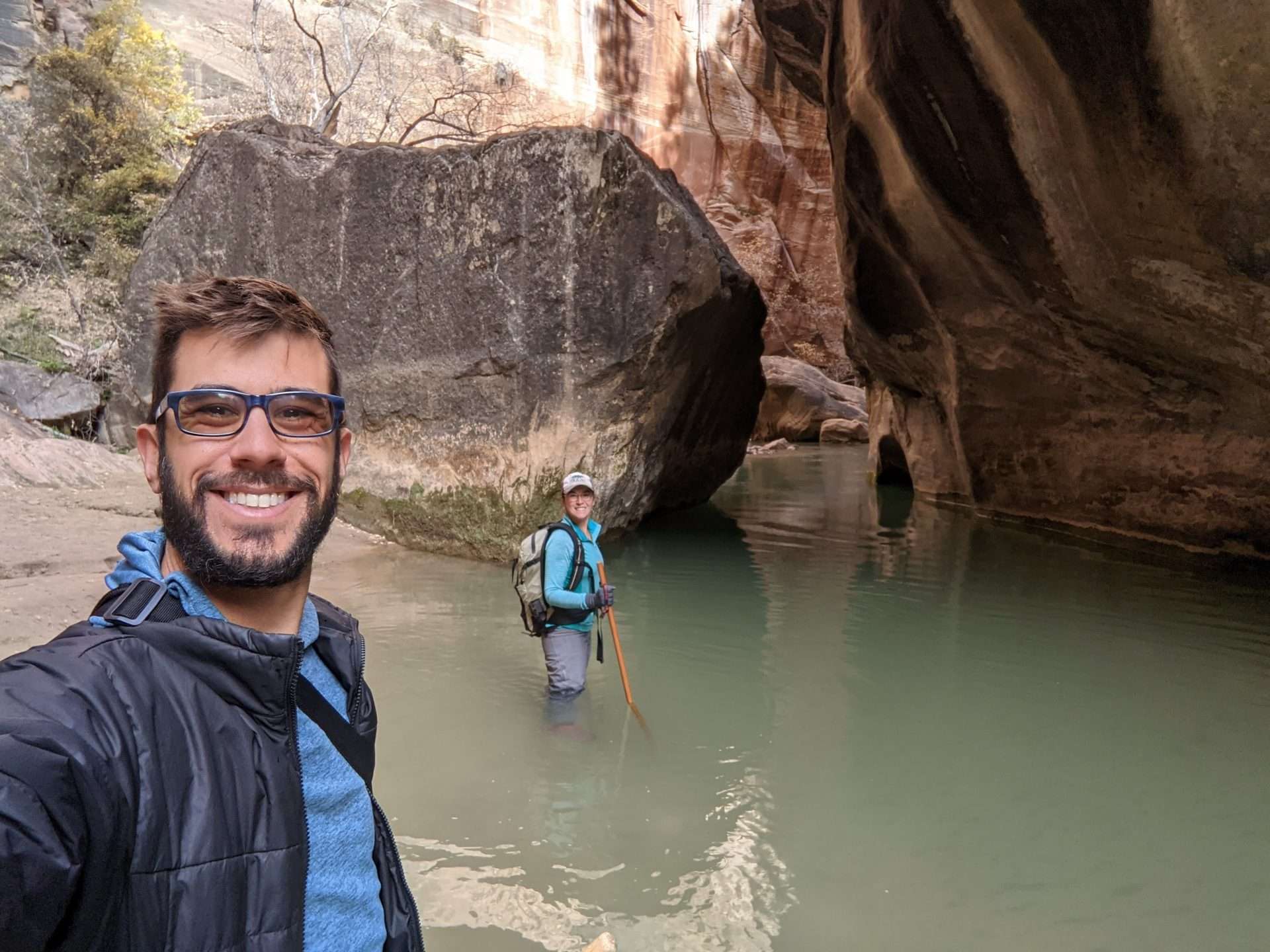 Tom and Cait hiking The Narrows in Zion