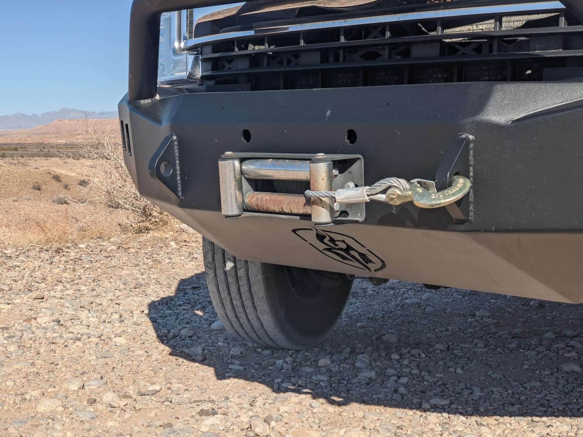 Close up on truck bumper with installed winch.
