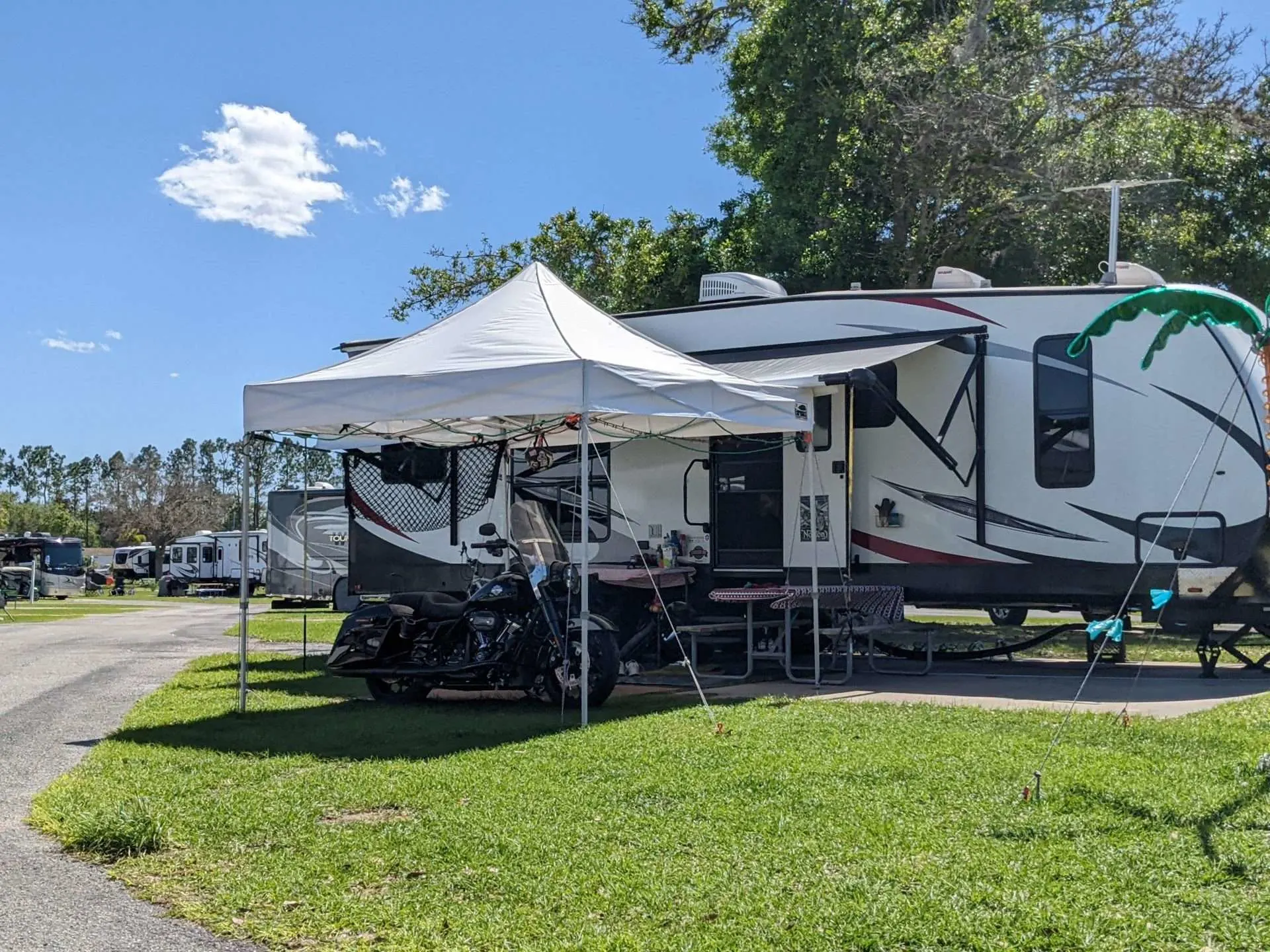 RV with external campsite set up in campground.
