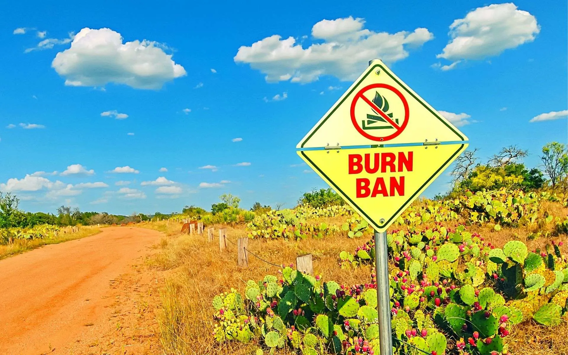 burn ban sign beside dirt road