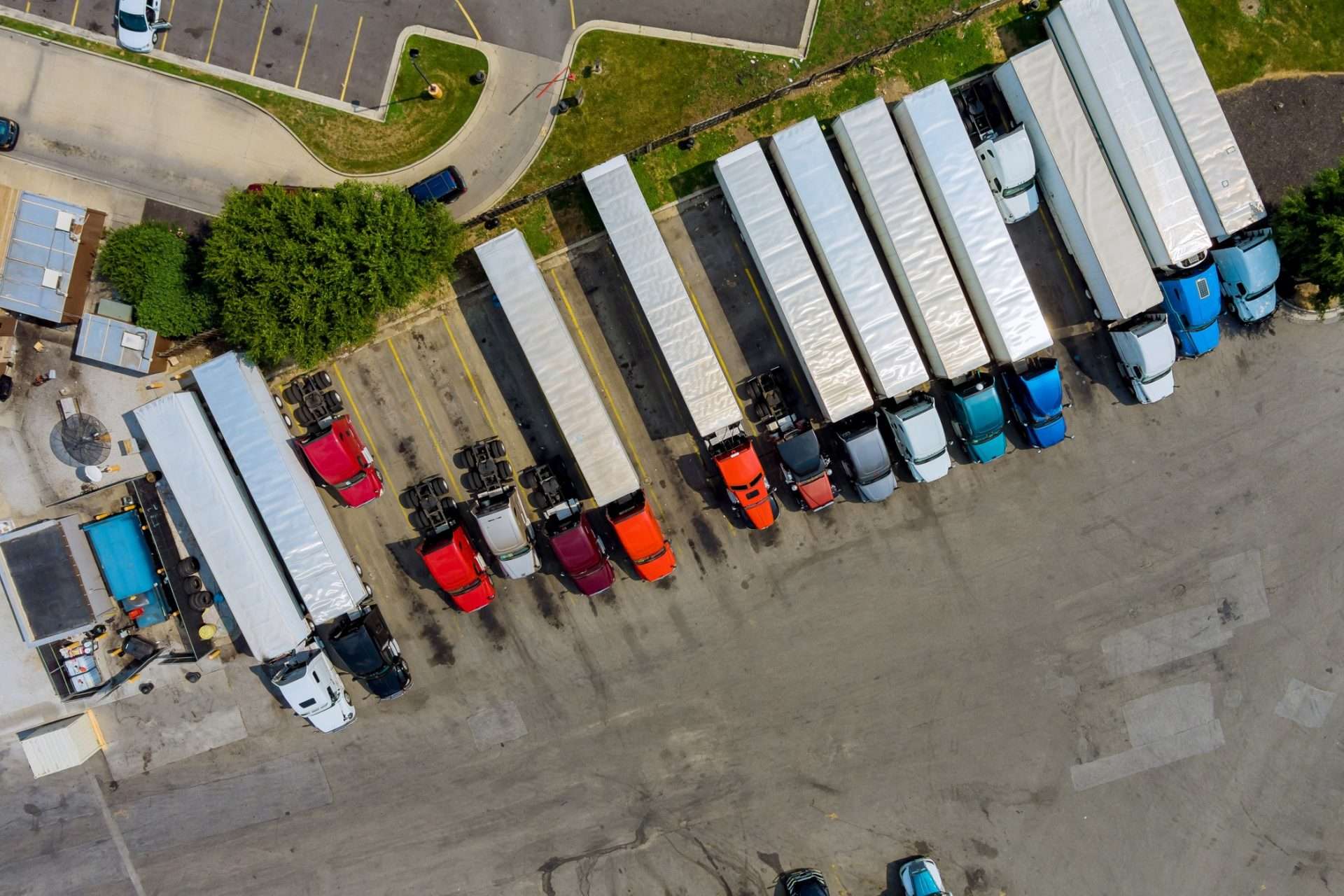 Aerial image of trucks parked in parking lot.