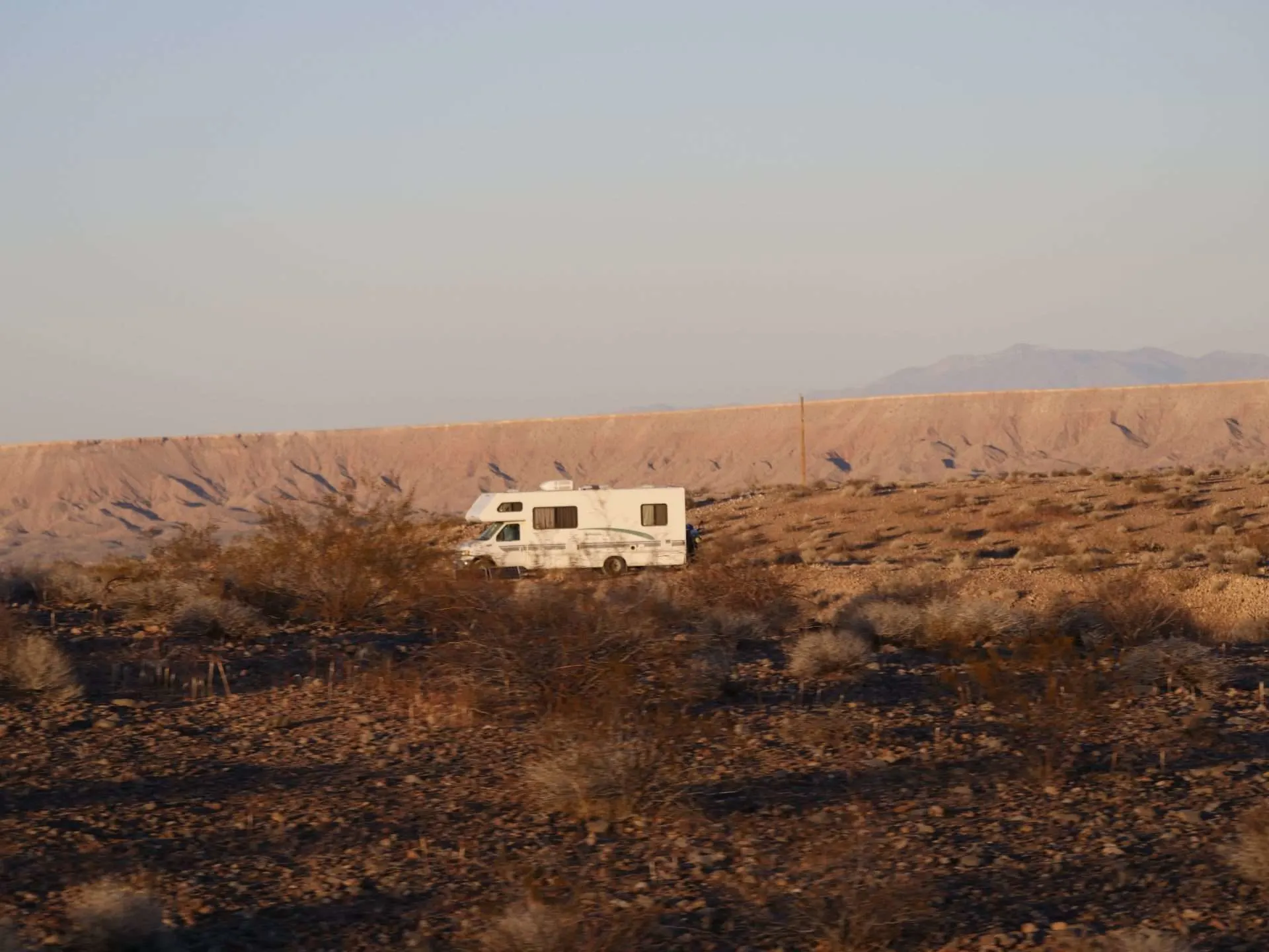 4x4 Class C RV motorhome driving in the desert