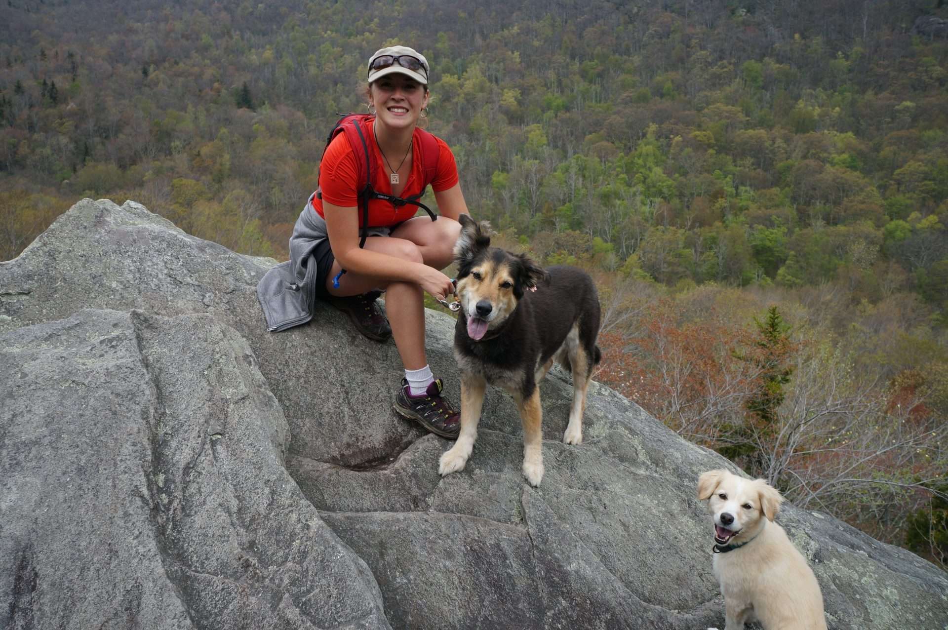 Caitlin Morton hiking with dogs