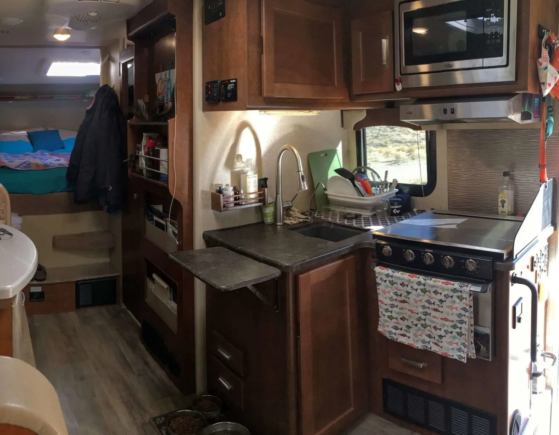 Interior of truck camper kitchen with countertop extension open