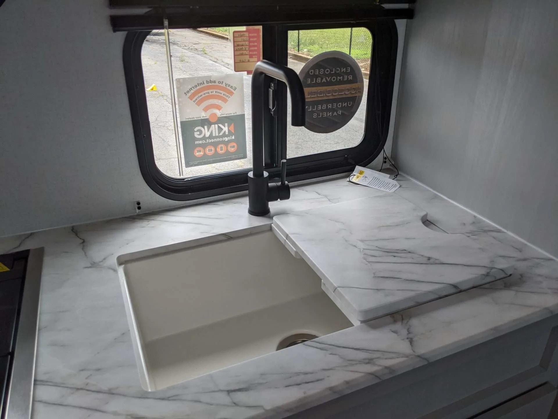 Close up of RV sink with marble sink cover.