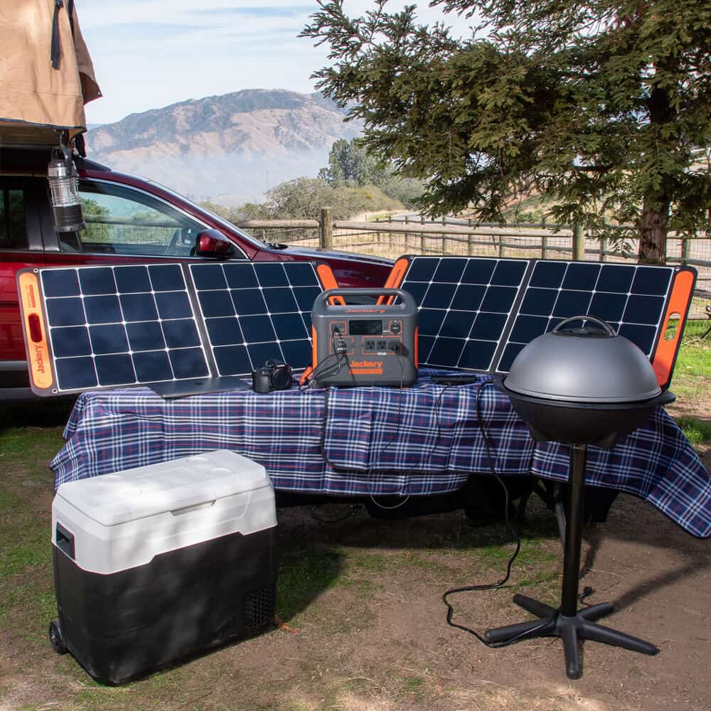 Jackery portable power station set up on picnic table