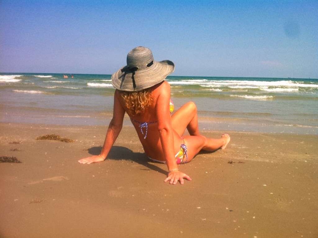 Woman tanning on the beach in Port Aransas
