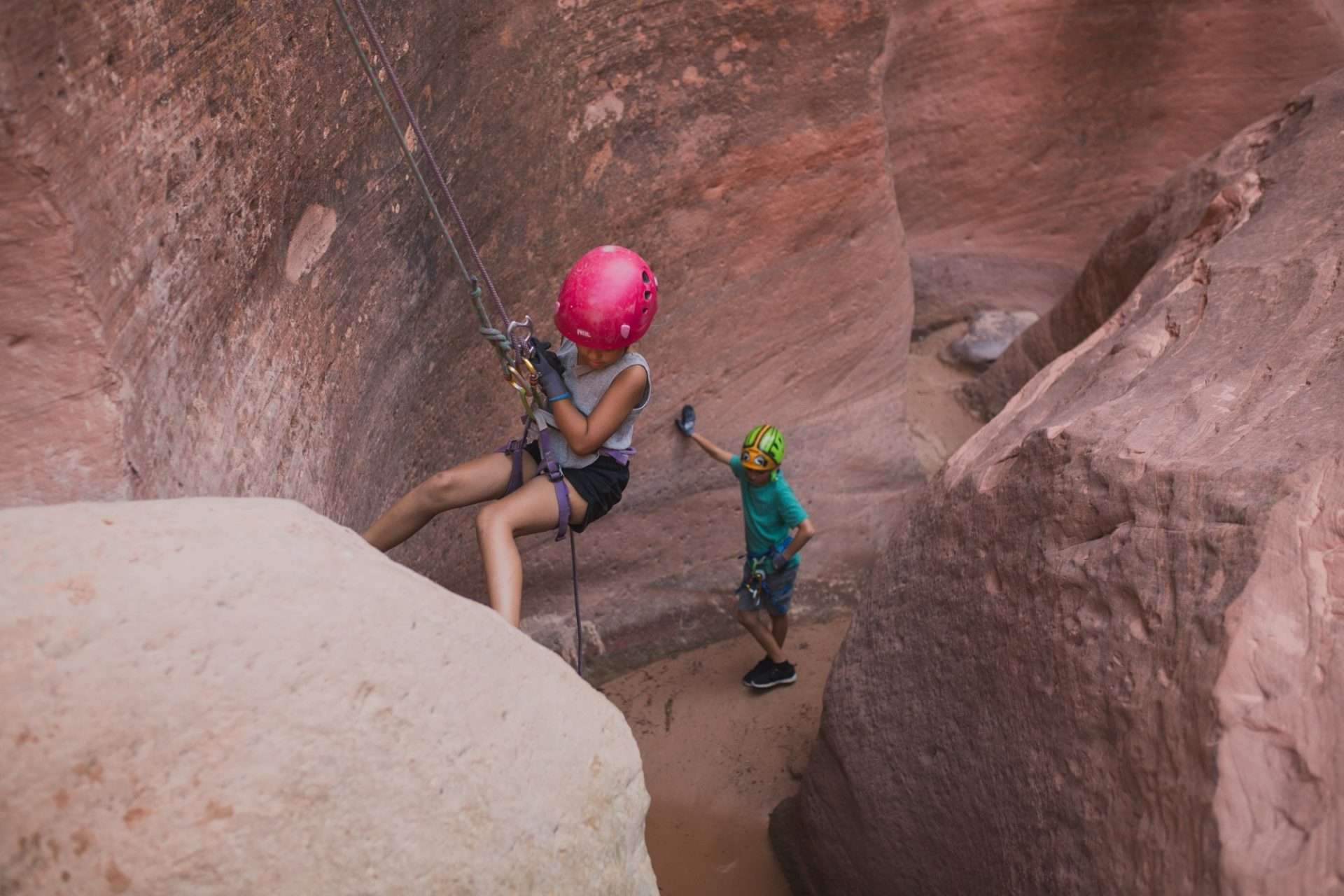 Two people canyoneering