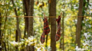 hiking socks hanging on a clothes line