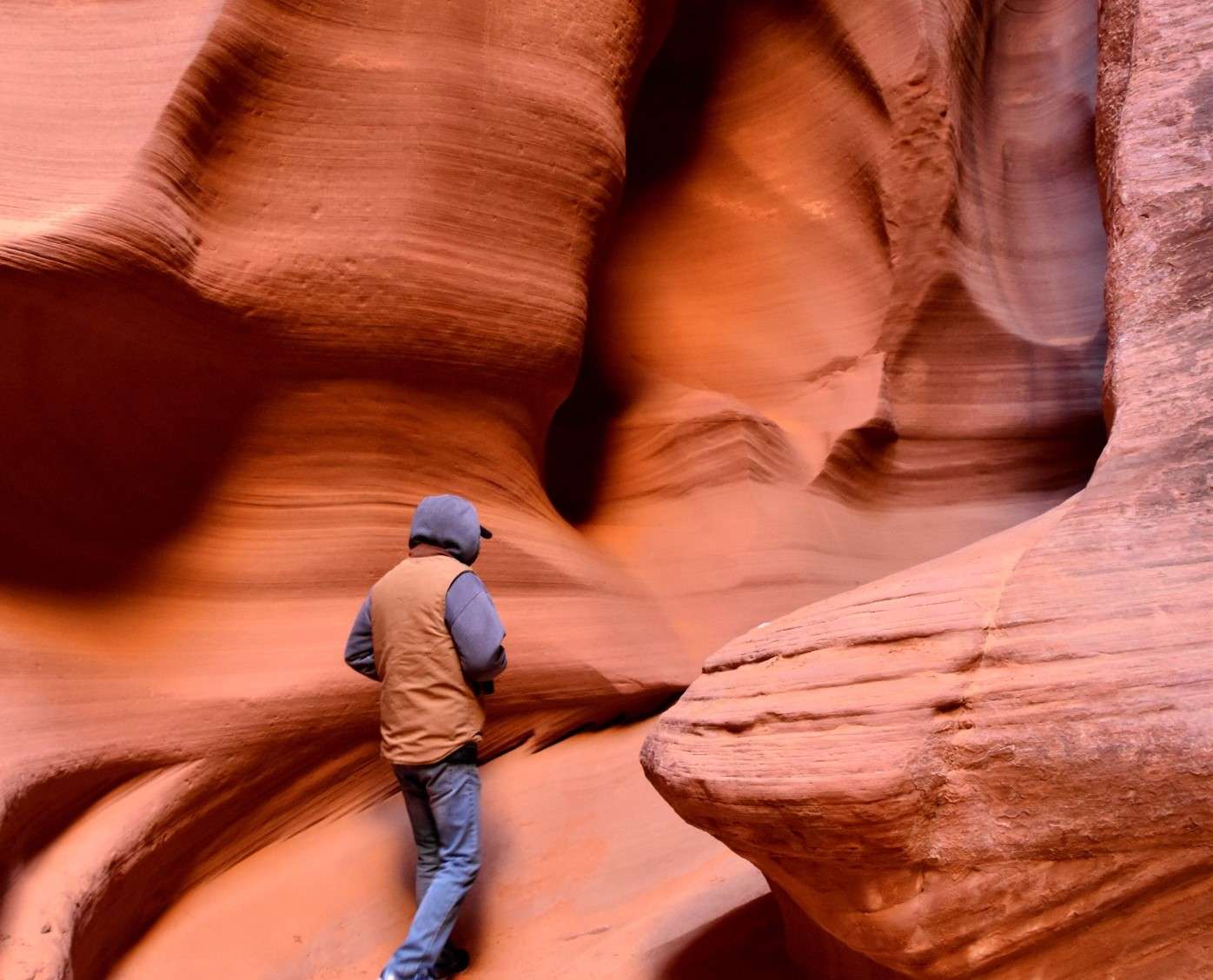 Man walking in slot canyon