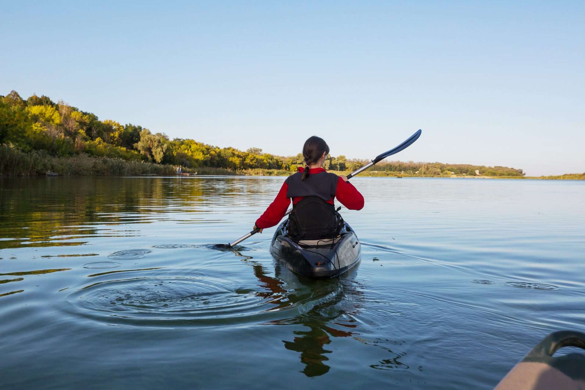 Woman kayaking on Lake Superior