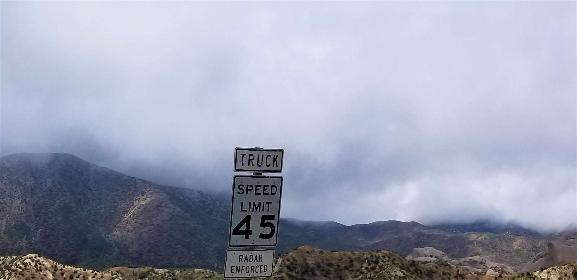 Truck speed limit sign on highway