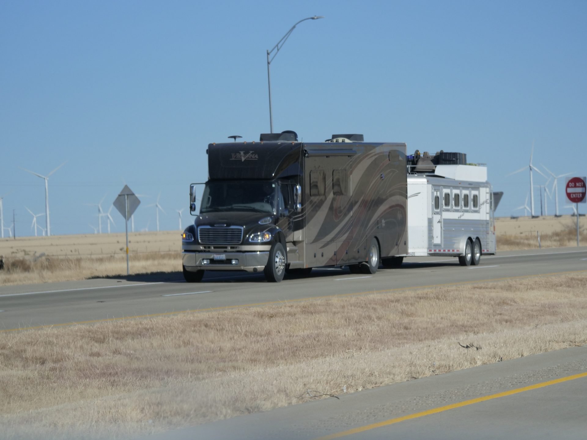 Super C motorhome pulling a trailer