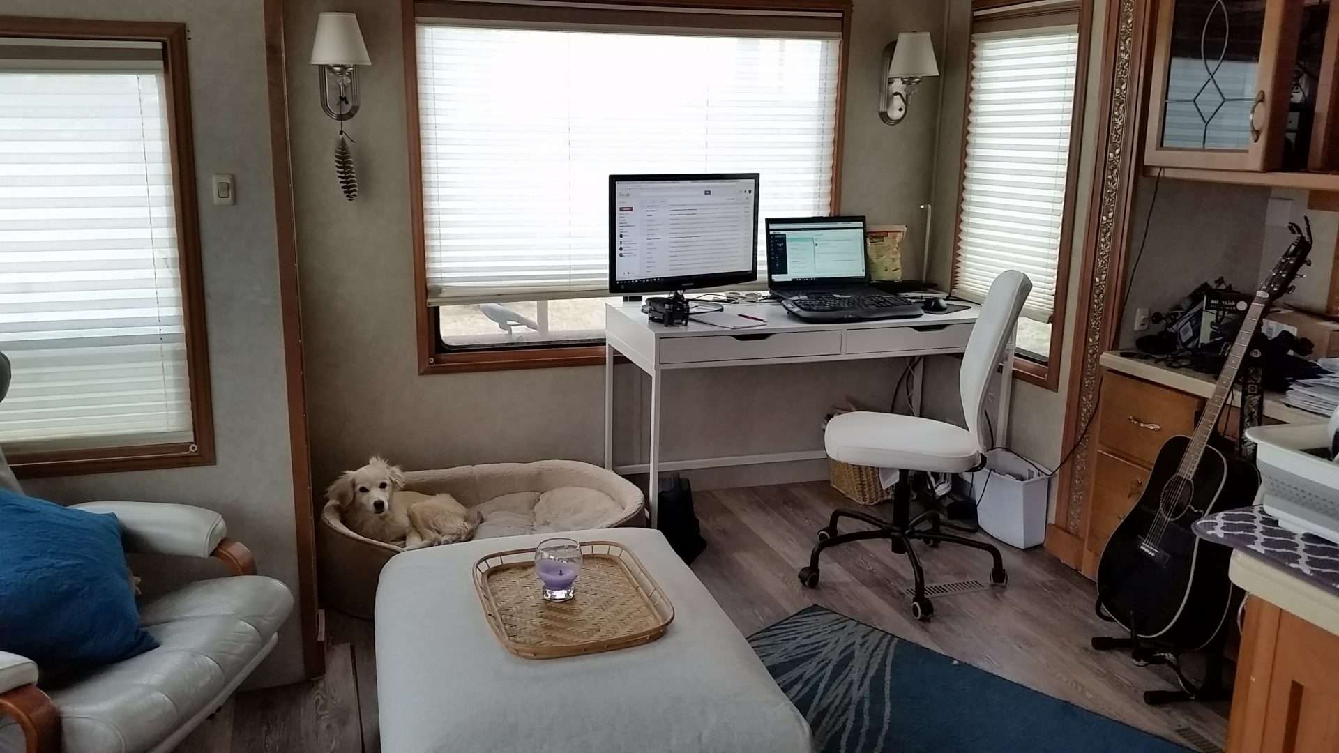 Interior of Mortons on the Move RV with desk and laptop set up