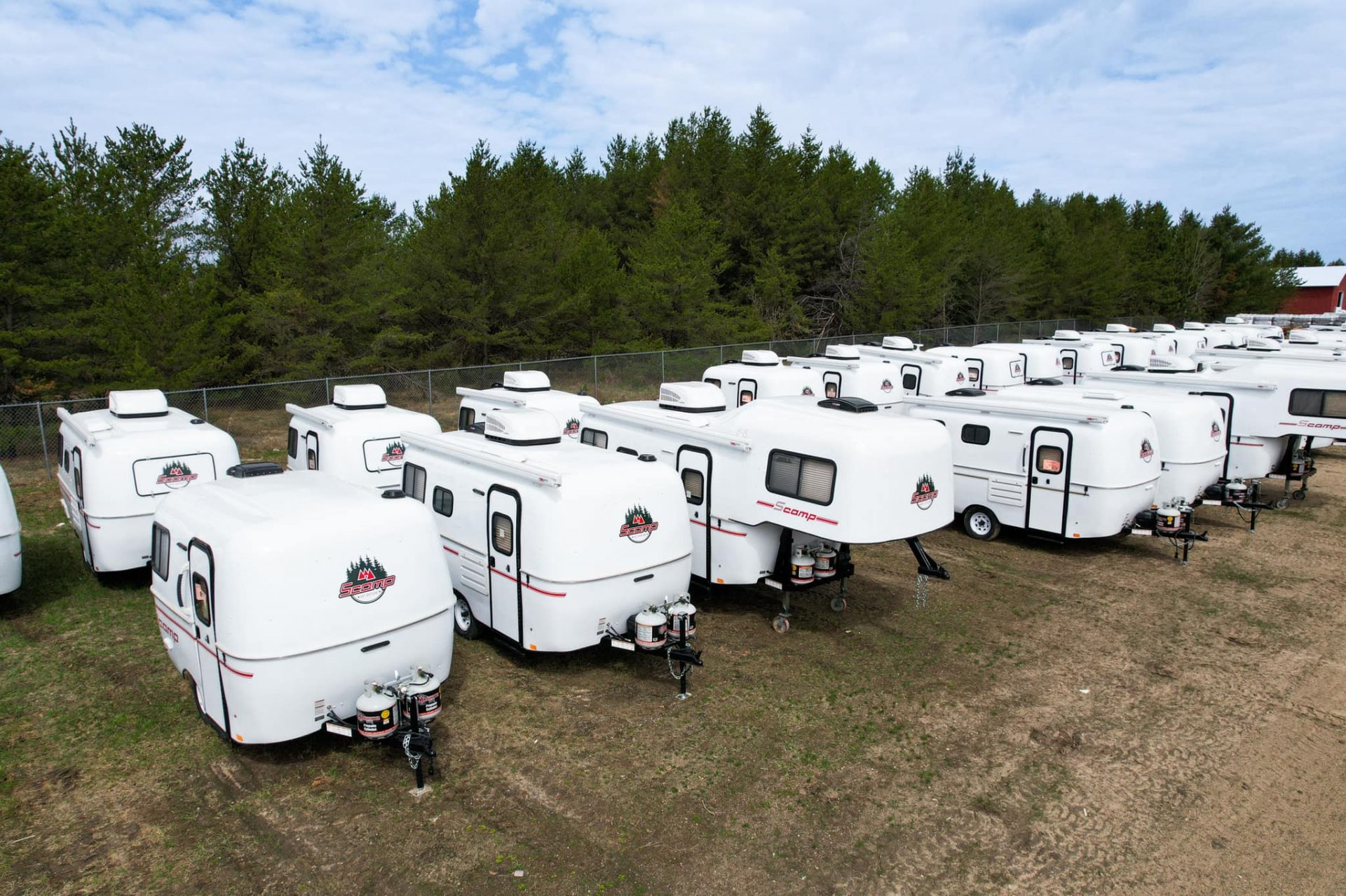 Scamp campers lined up in RV sales lot from company website