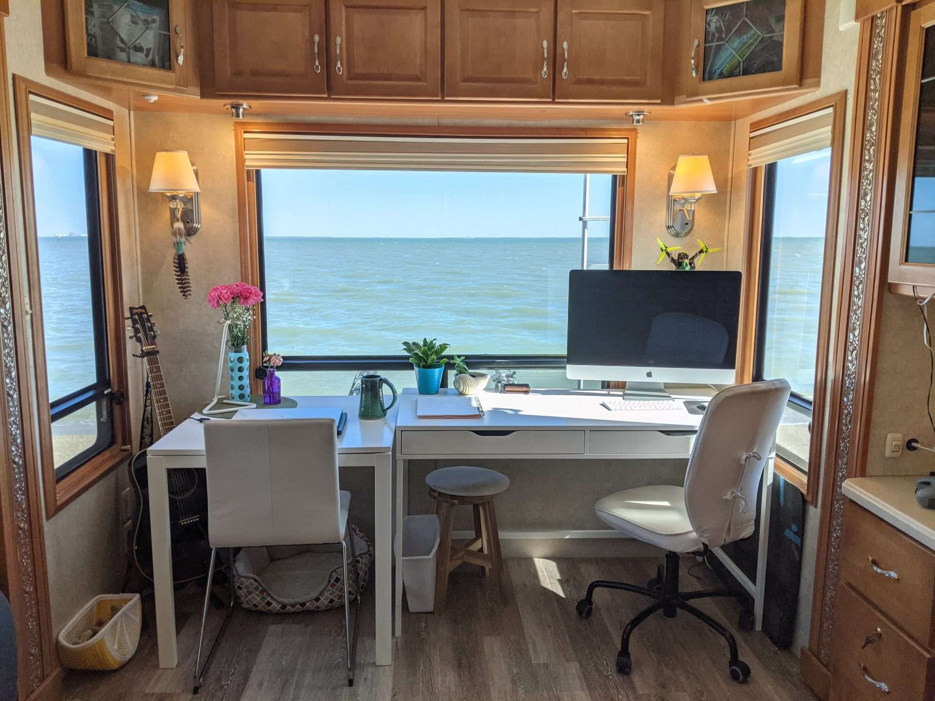 RV desk and computer looking out window to the ocean