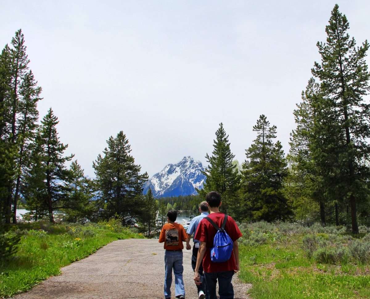 Family walking through Grand Teton National Park together.