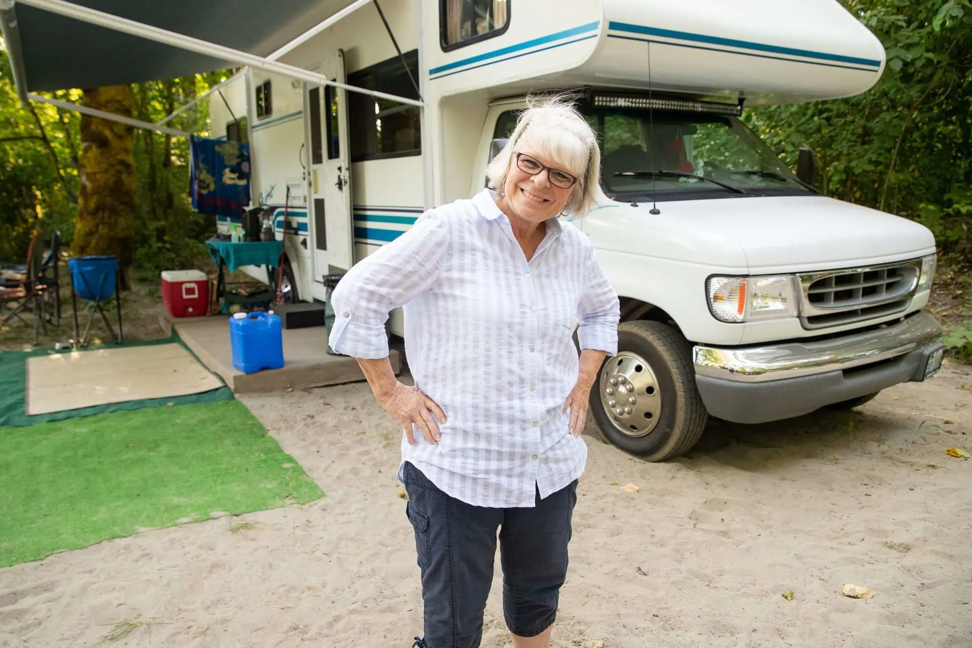 Older woman standing in front of RV