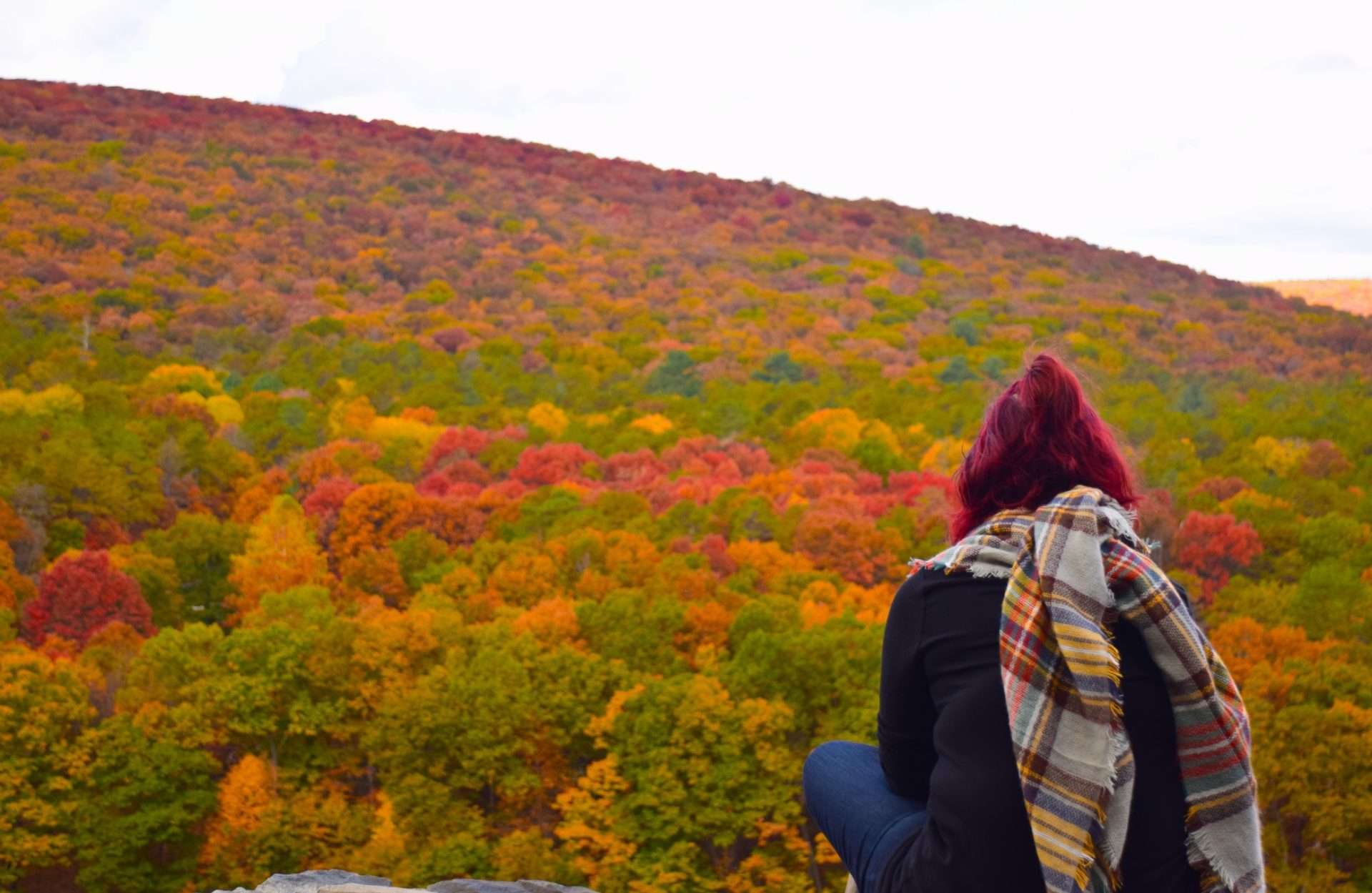 Woman hiking in the Catskills in the fall