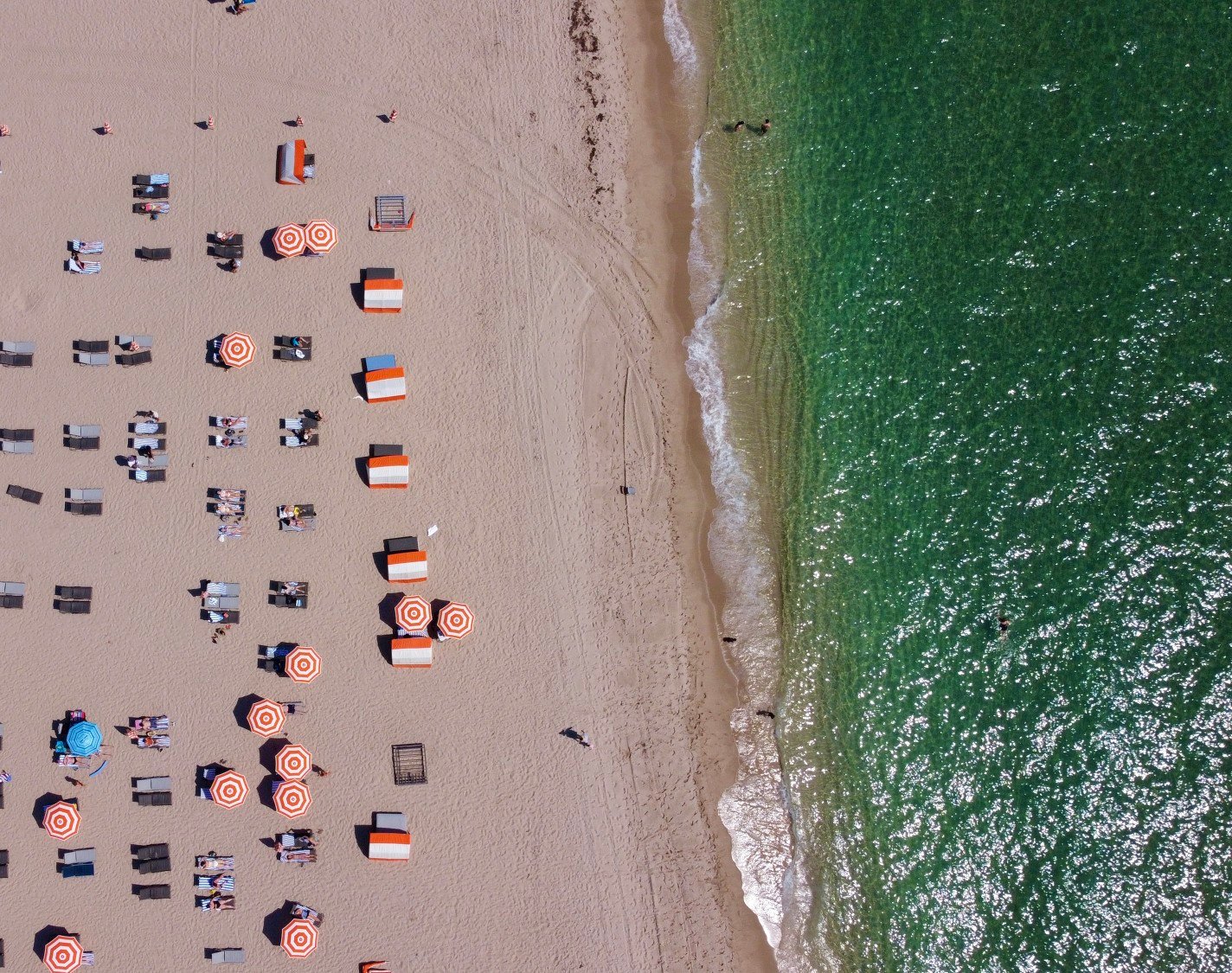 Aerial view looking down at umbrellas and beach chairs on Fort Lauderdale beach