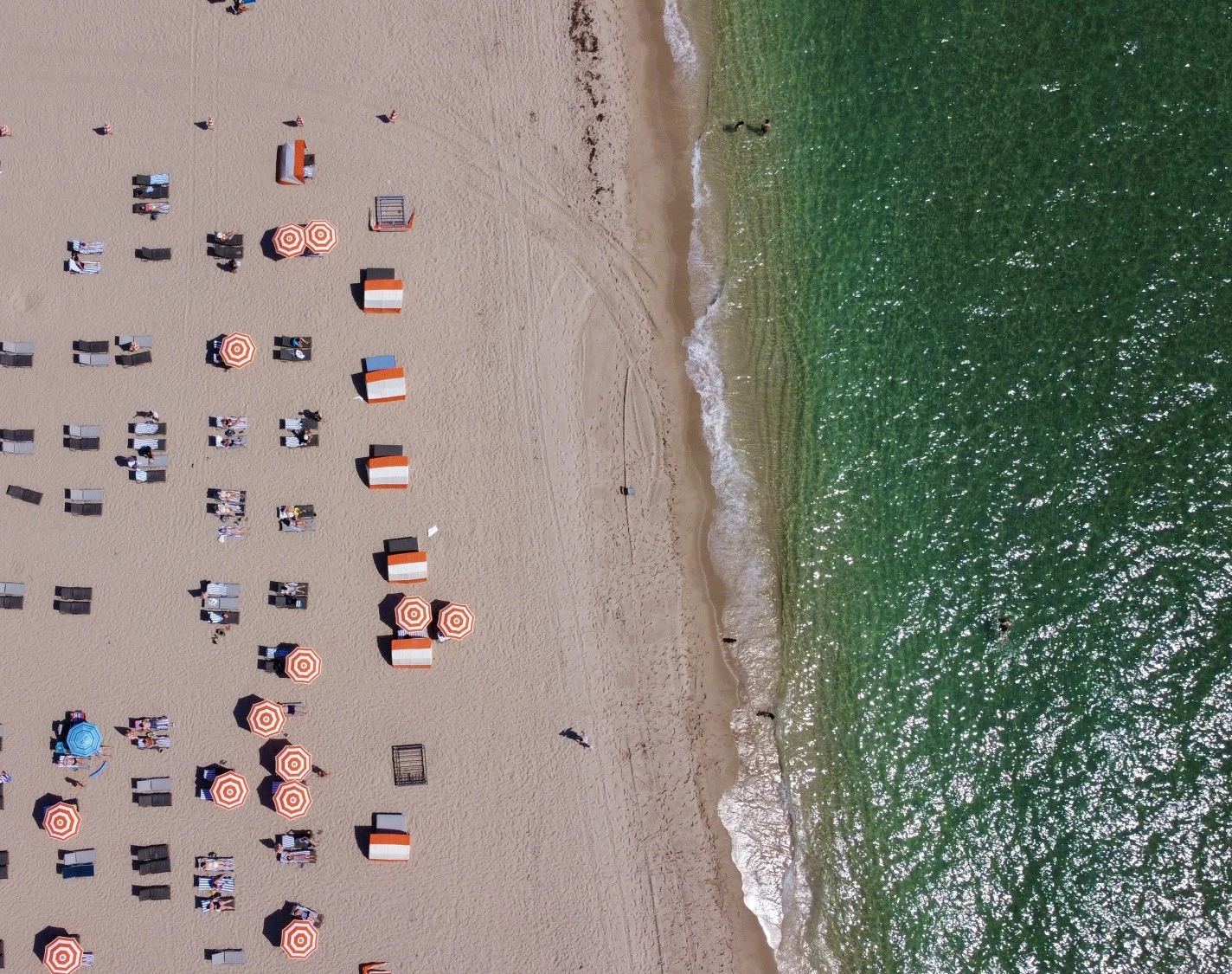 Aerial view looking down at umbrellas and beach chairs on Fort Lauderdale beach