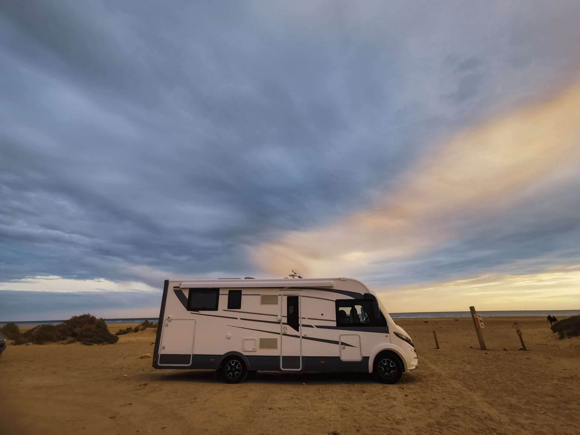 RV beach camping at sunset