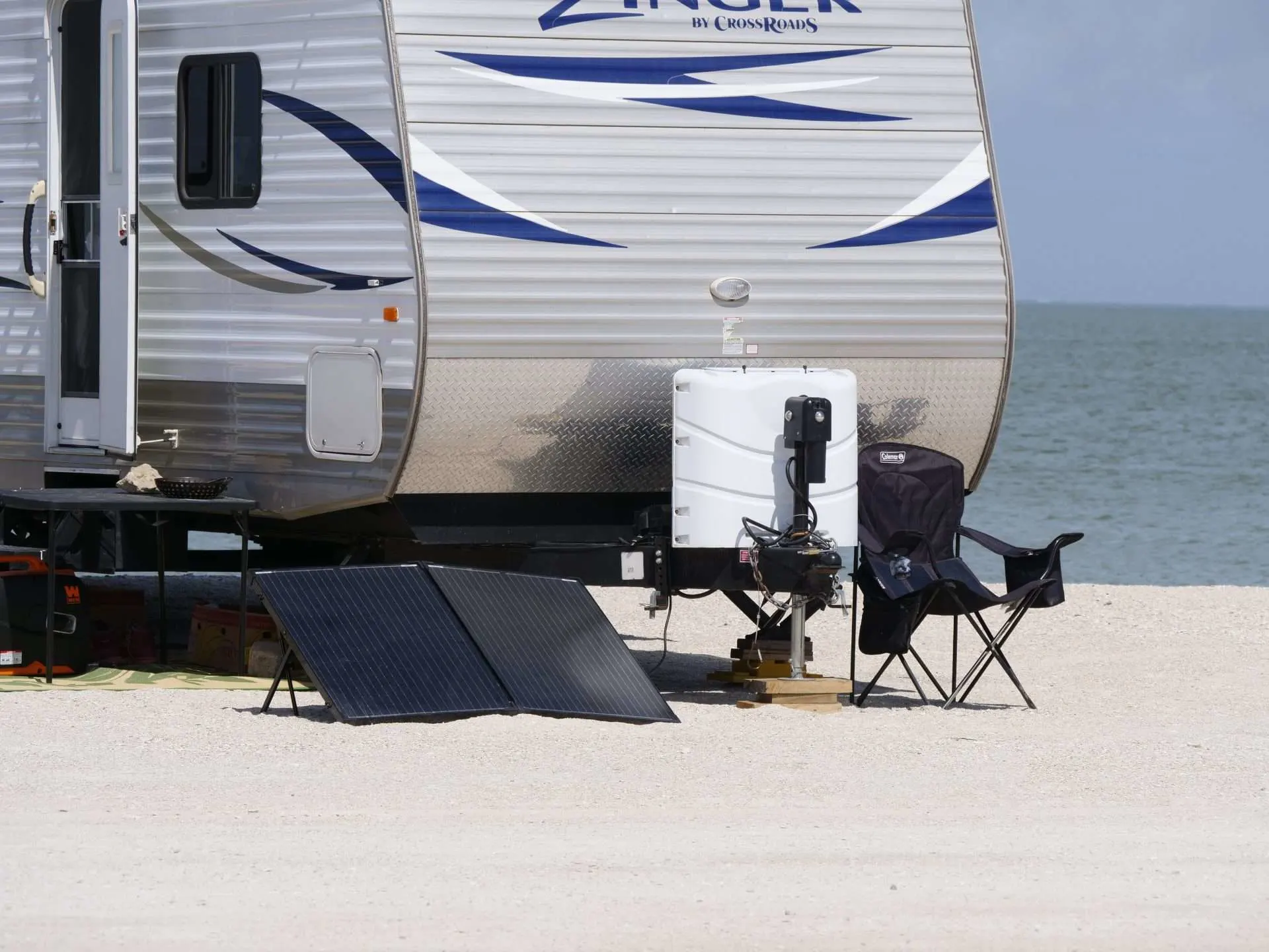 portable solar panels next to RV on beach