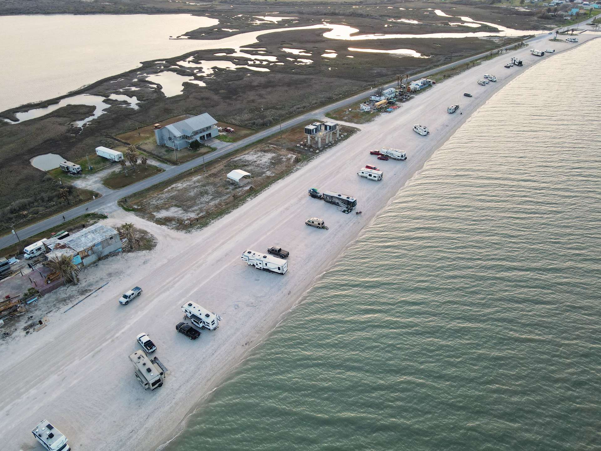 many rvs parked along a beach in texas