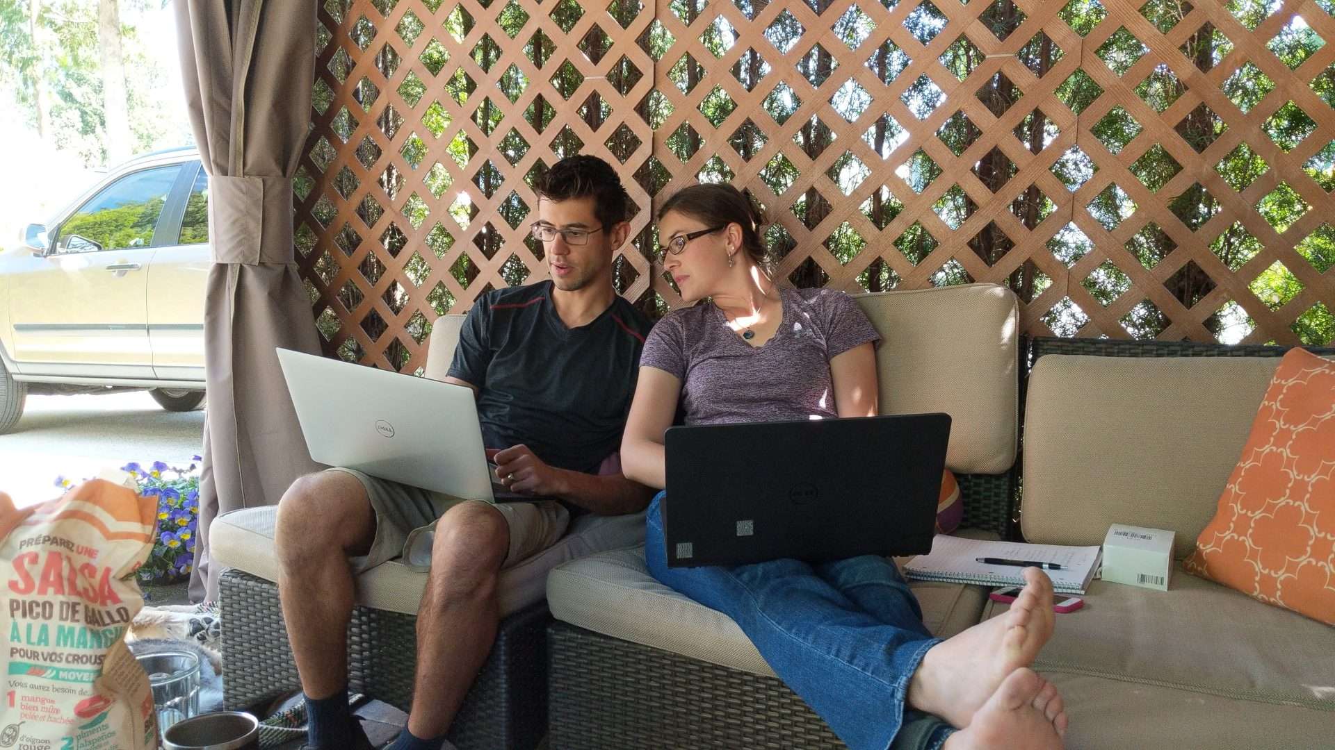 Tom and Cait doing research on their laptops