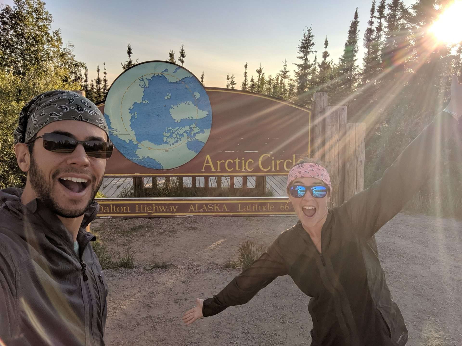 Tom and Cait from Mortons on the Move posing in front of the Arctic Circle entry way sign.