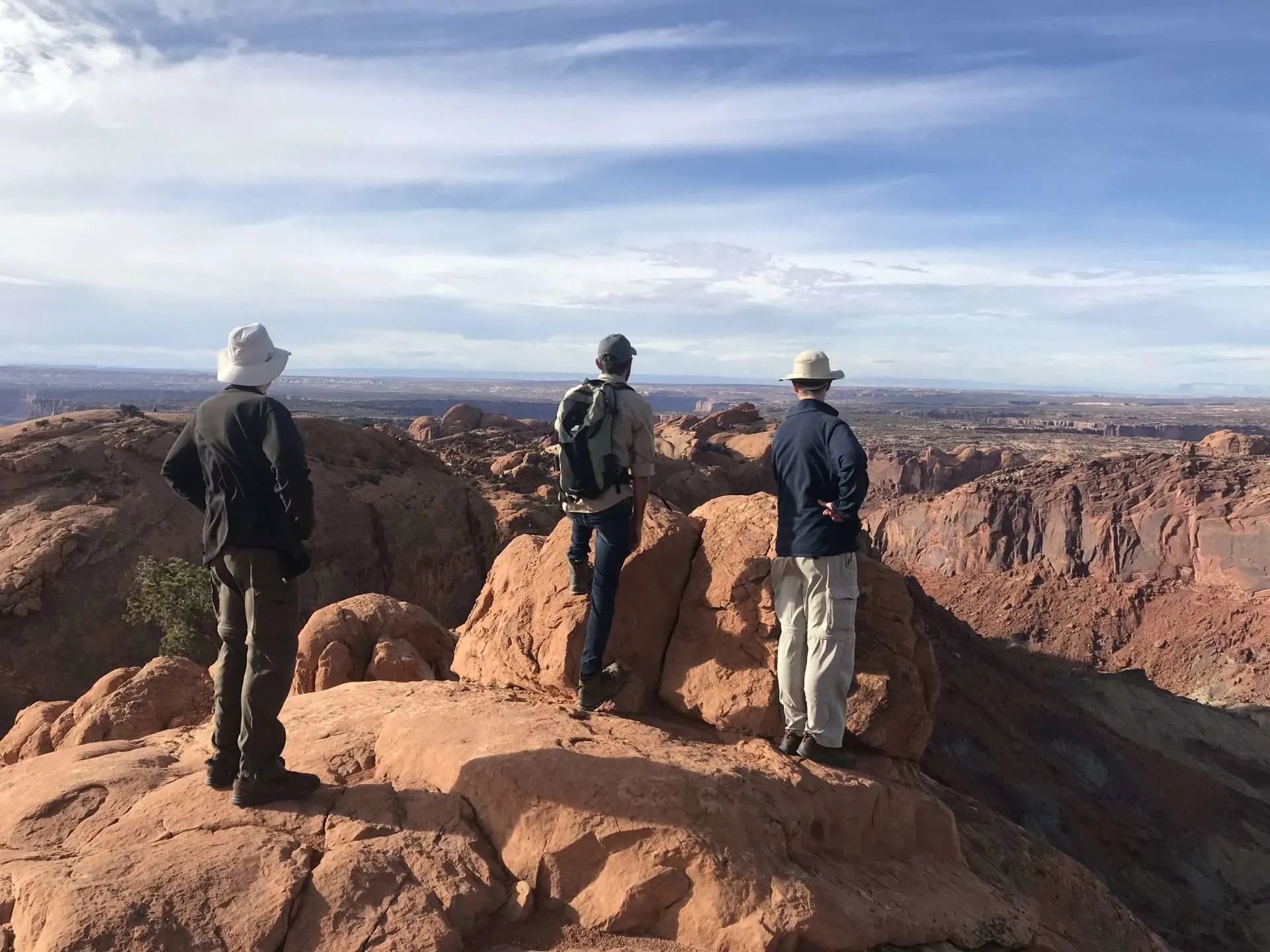 Three men hiking in Canyonlands