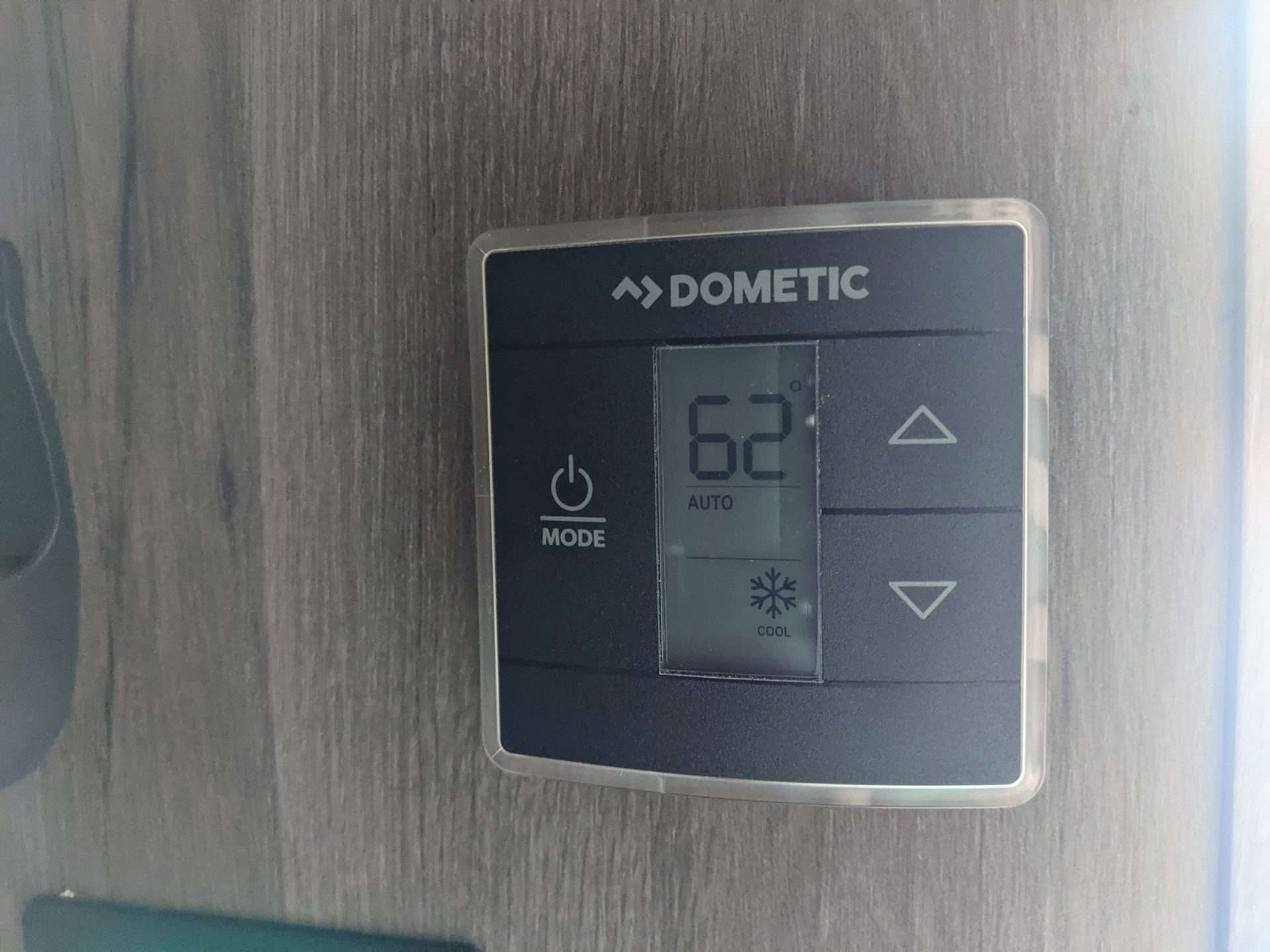 Dometic thermostat set at 62 degrees in RV.