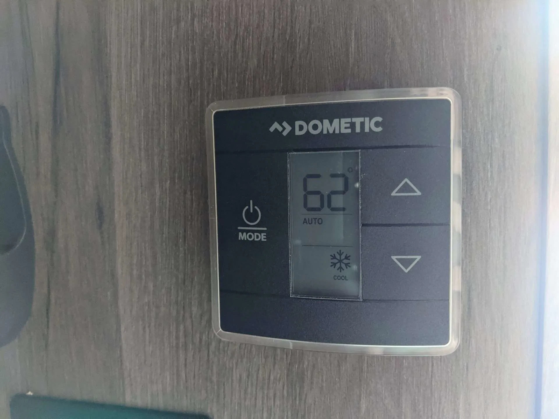 Dometic thermostat set at 62 degrees in RV.