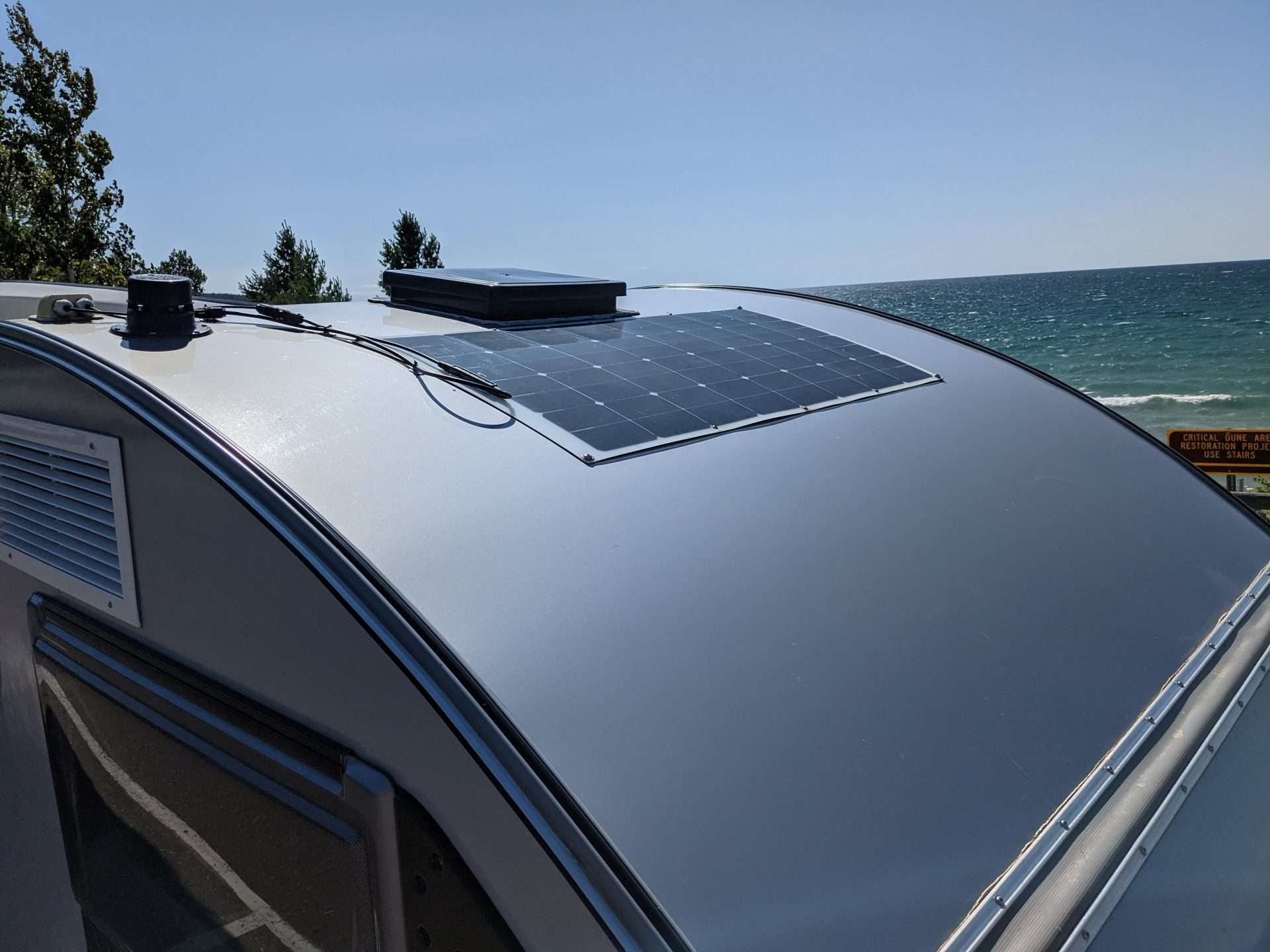 teardrop camper with flexible solar panel on roof