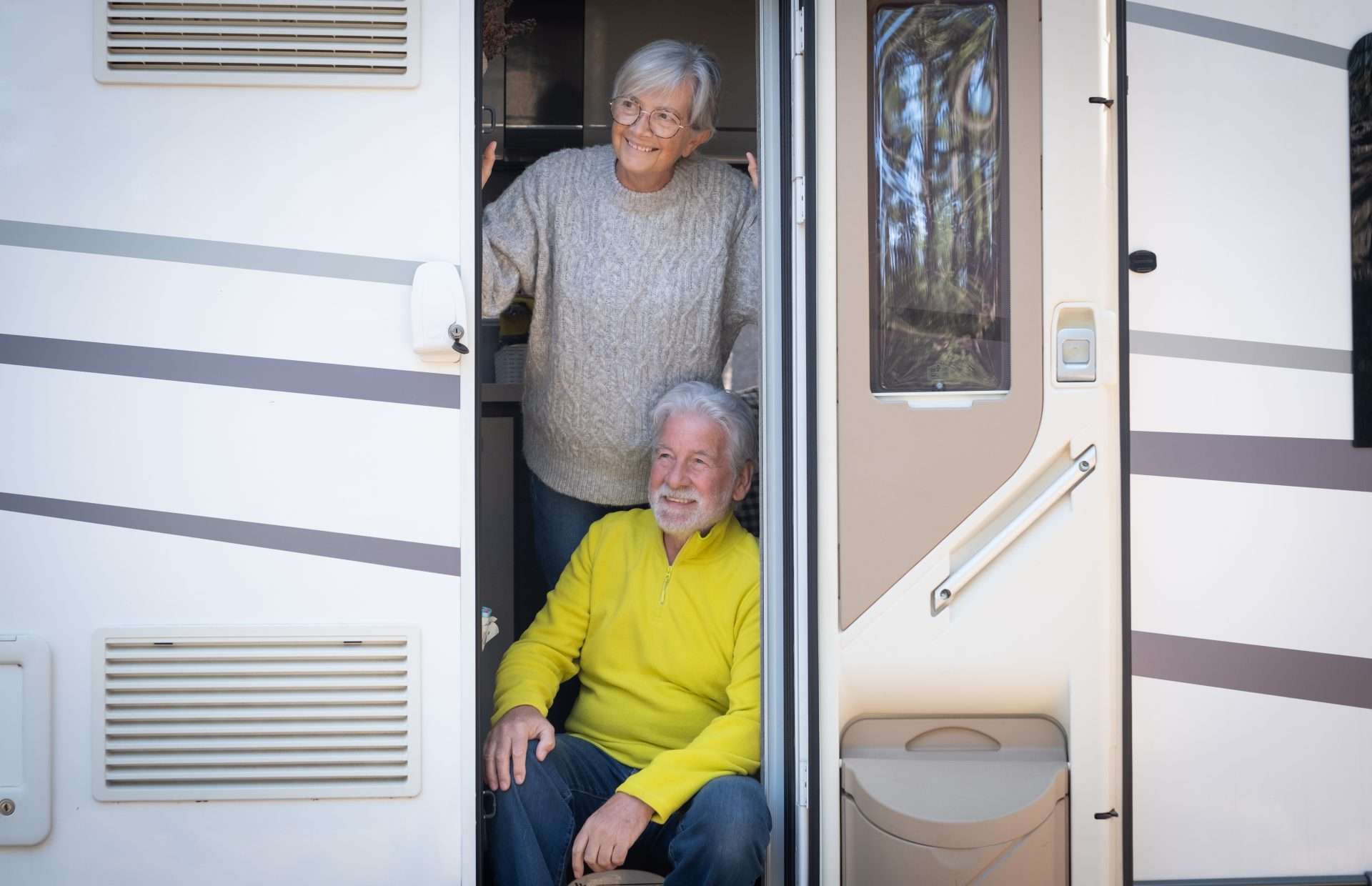Older couple standing in RV doorway
