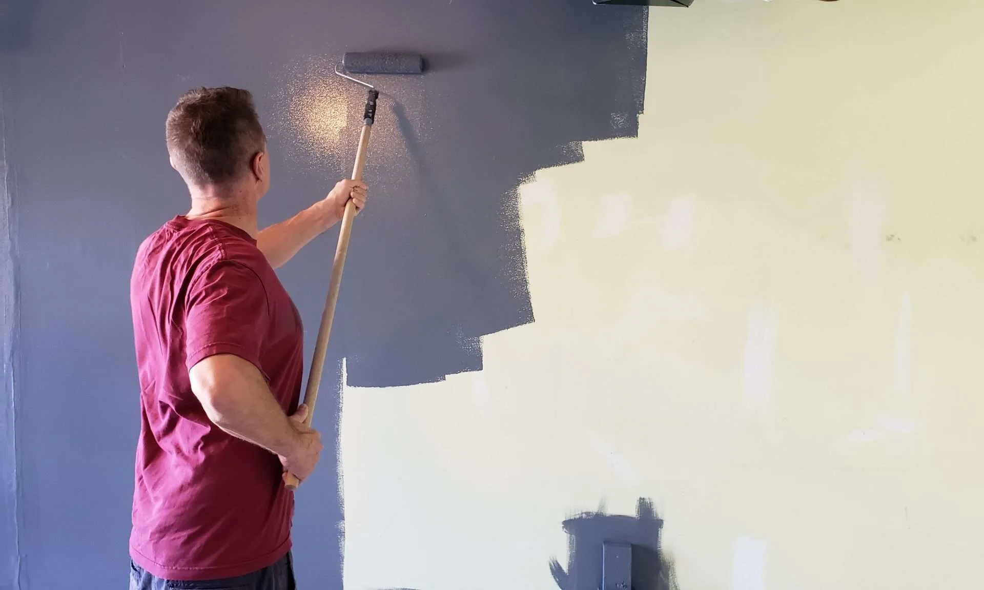 Man painting walls of toy hauler interior