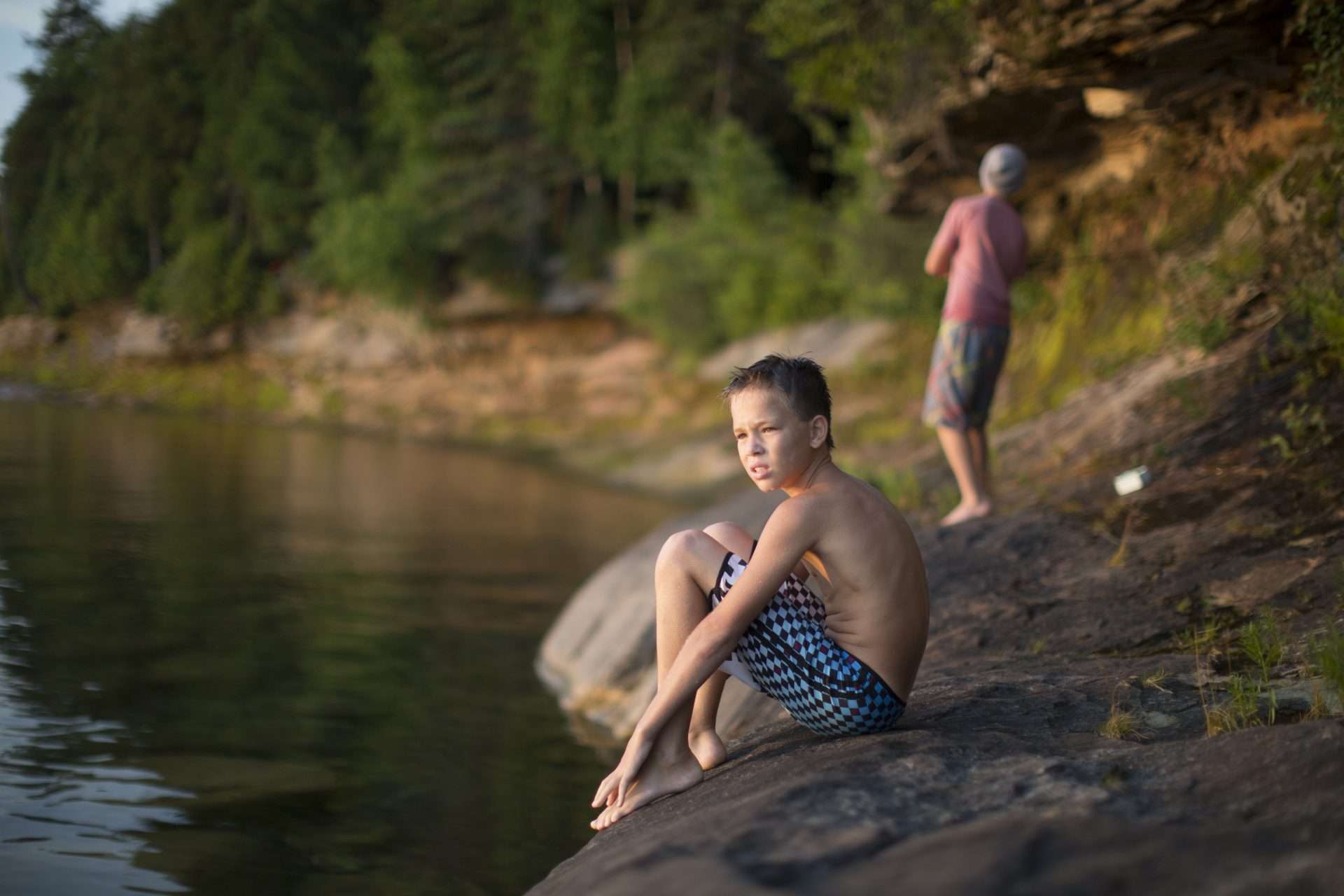 Boys playing in Lake Superior in the summer.