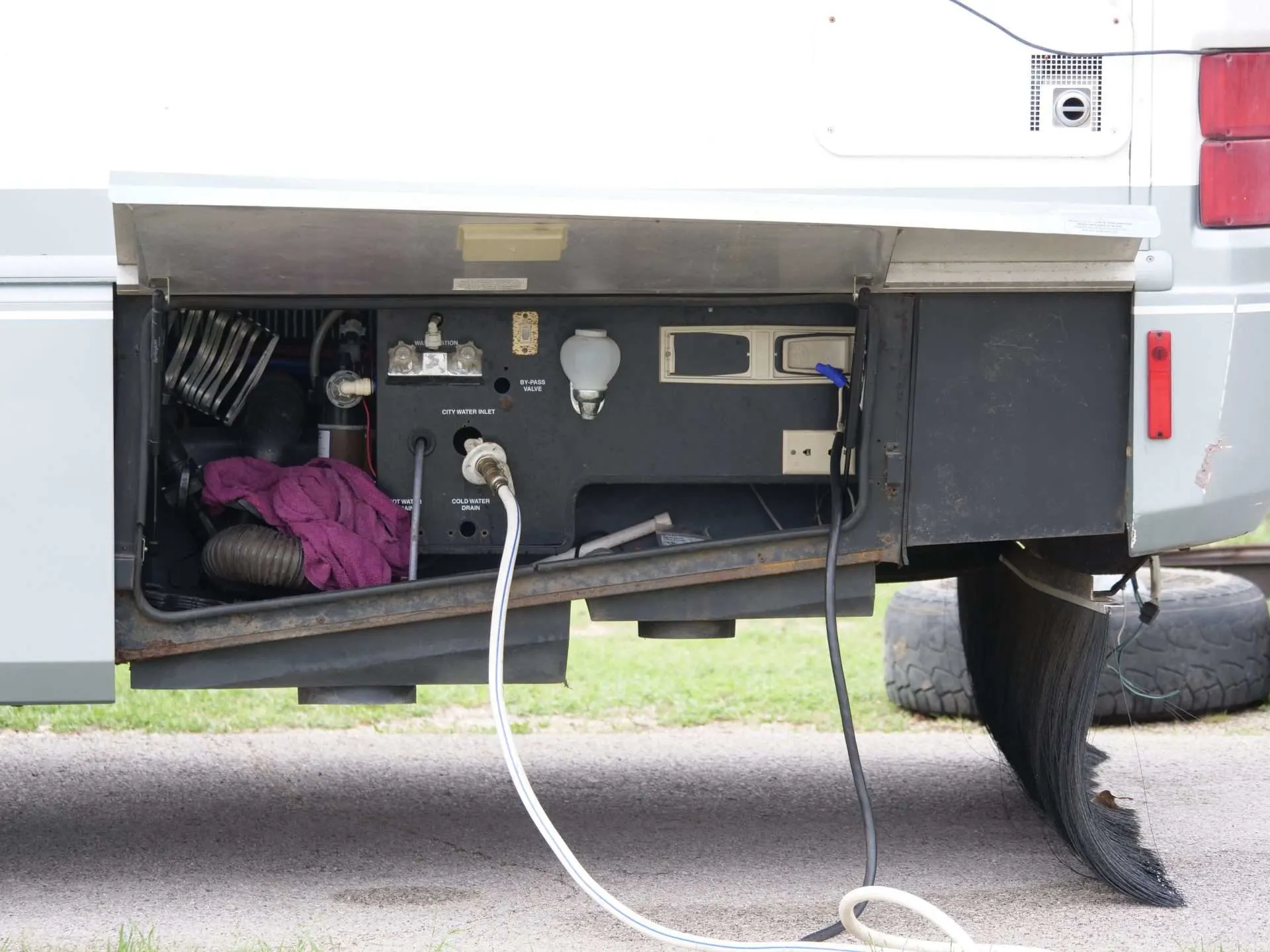 Underside of RV with hose connection