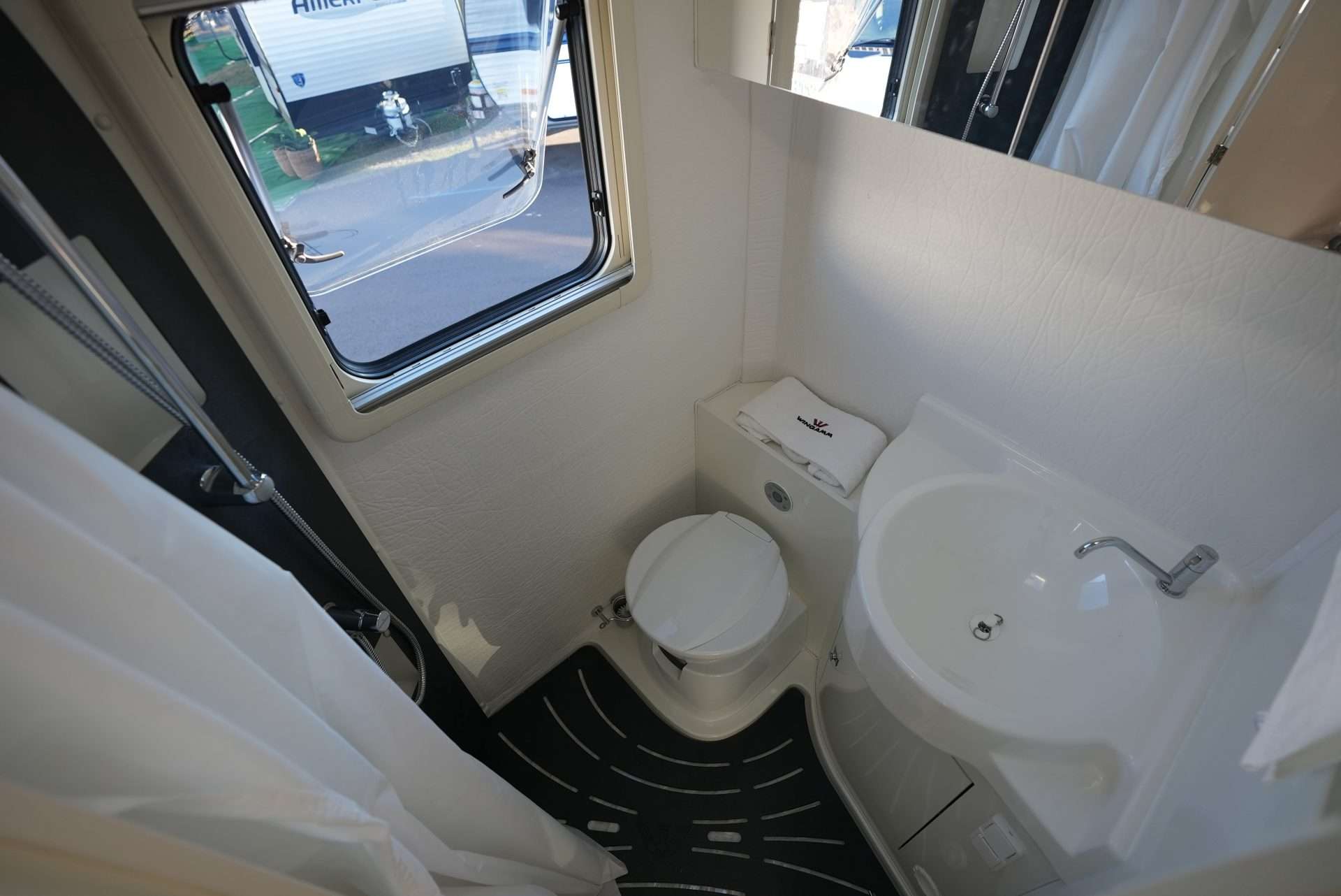 Aerial view of small RV bathroom from RV shower.