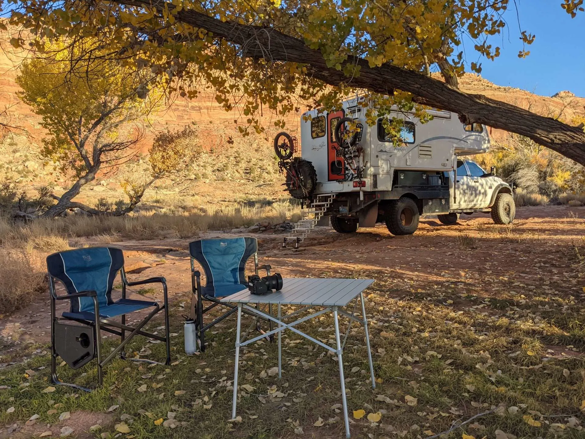 Truck camper set up to camp on BLM land