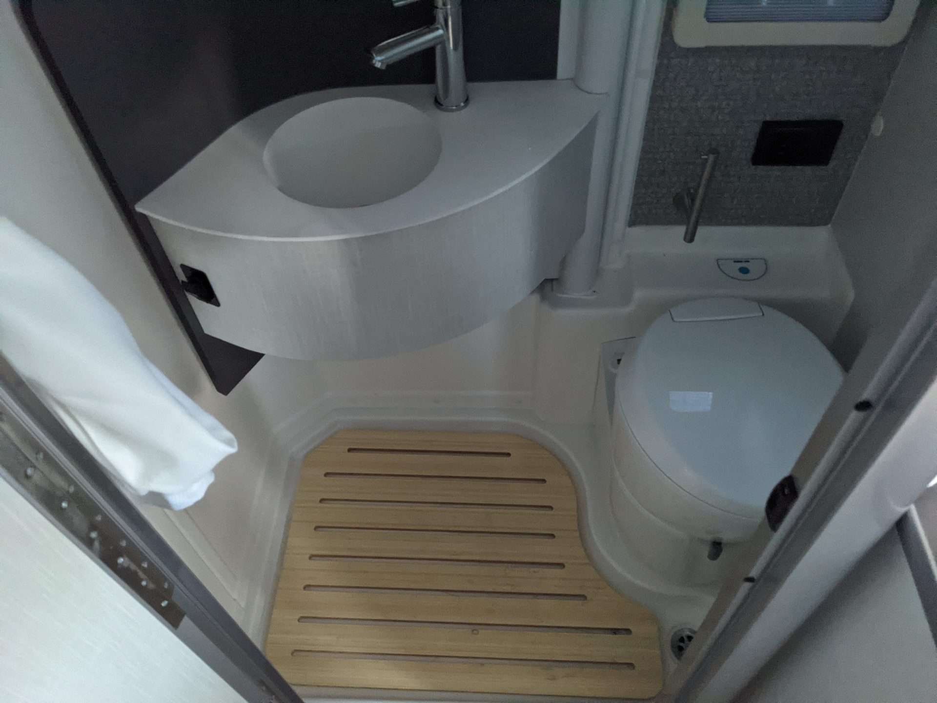 Interior of campervan bathroom with shower and toilet